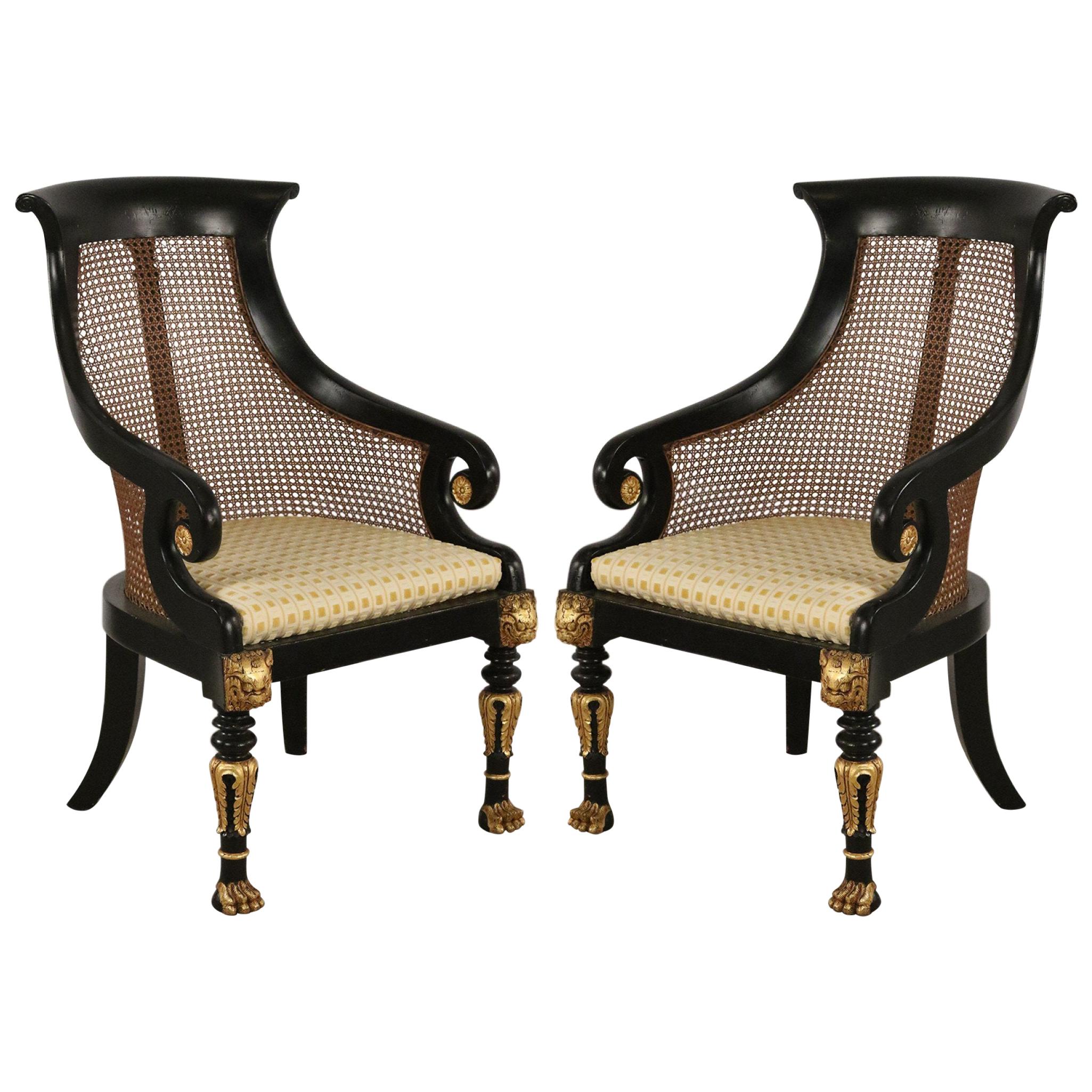 Pair of English Regency Style Carved Black and Gilt Cane Back Armchairs