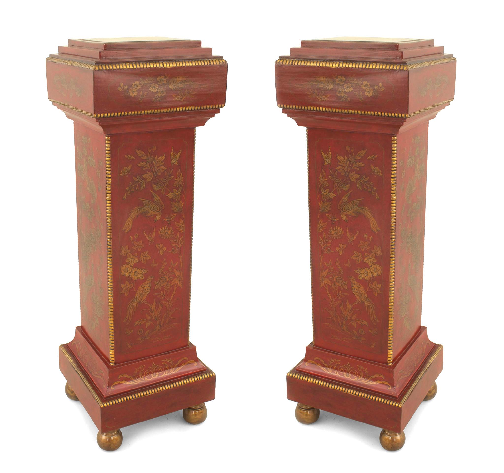 Pair of English Regency style (20th Cent) red lacquered pedestals with floral and bird chinoiserie decoration.
