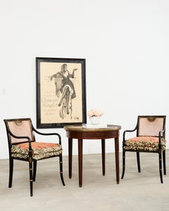 Coppia di sedie a gomito in stile Reggenza inglese, con canne in ebano