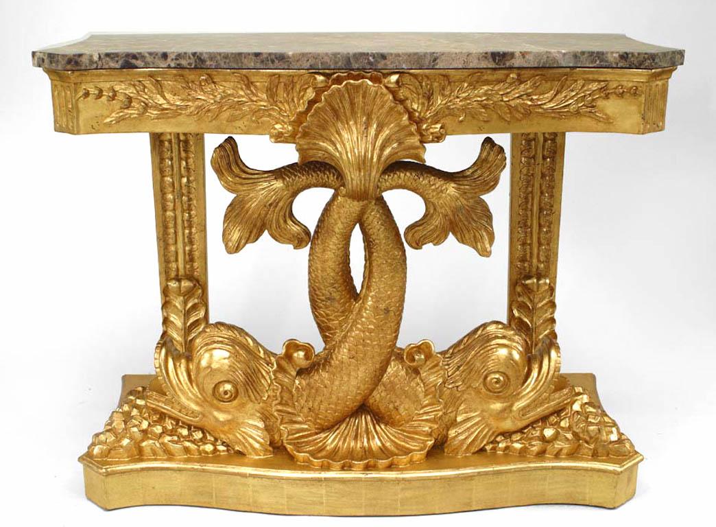 Pair of English Regency style gilt console tables with two entwined carved dolphins supporting a floral design apron with a mirror back and shaped brown marble top (20th century).
      