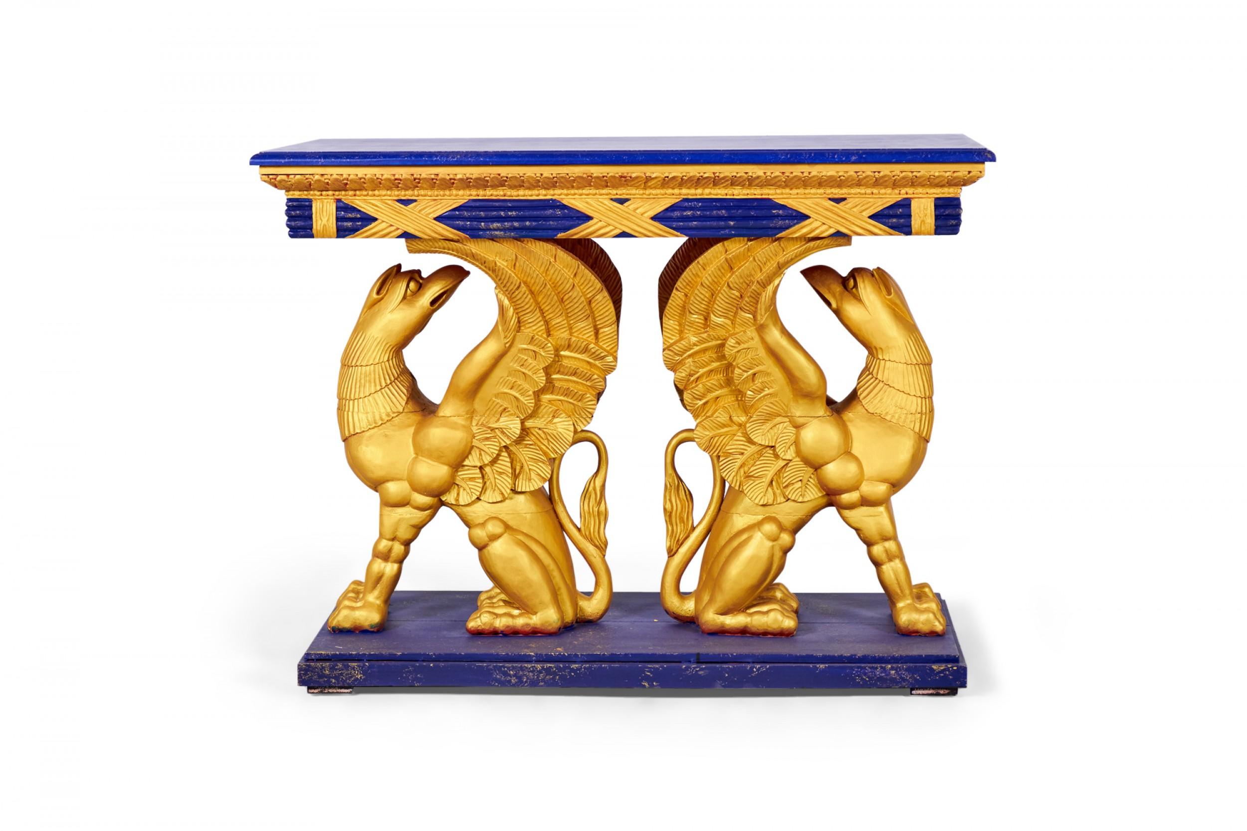 PAIR of English Regency-style console tables with painted faux blue stone wooden tops resting on carved wooden gilt eagle bases. (PRICED AS PAIR)

Condition: Good; Wear consistent with age and use