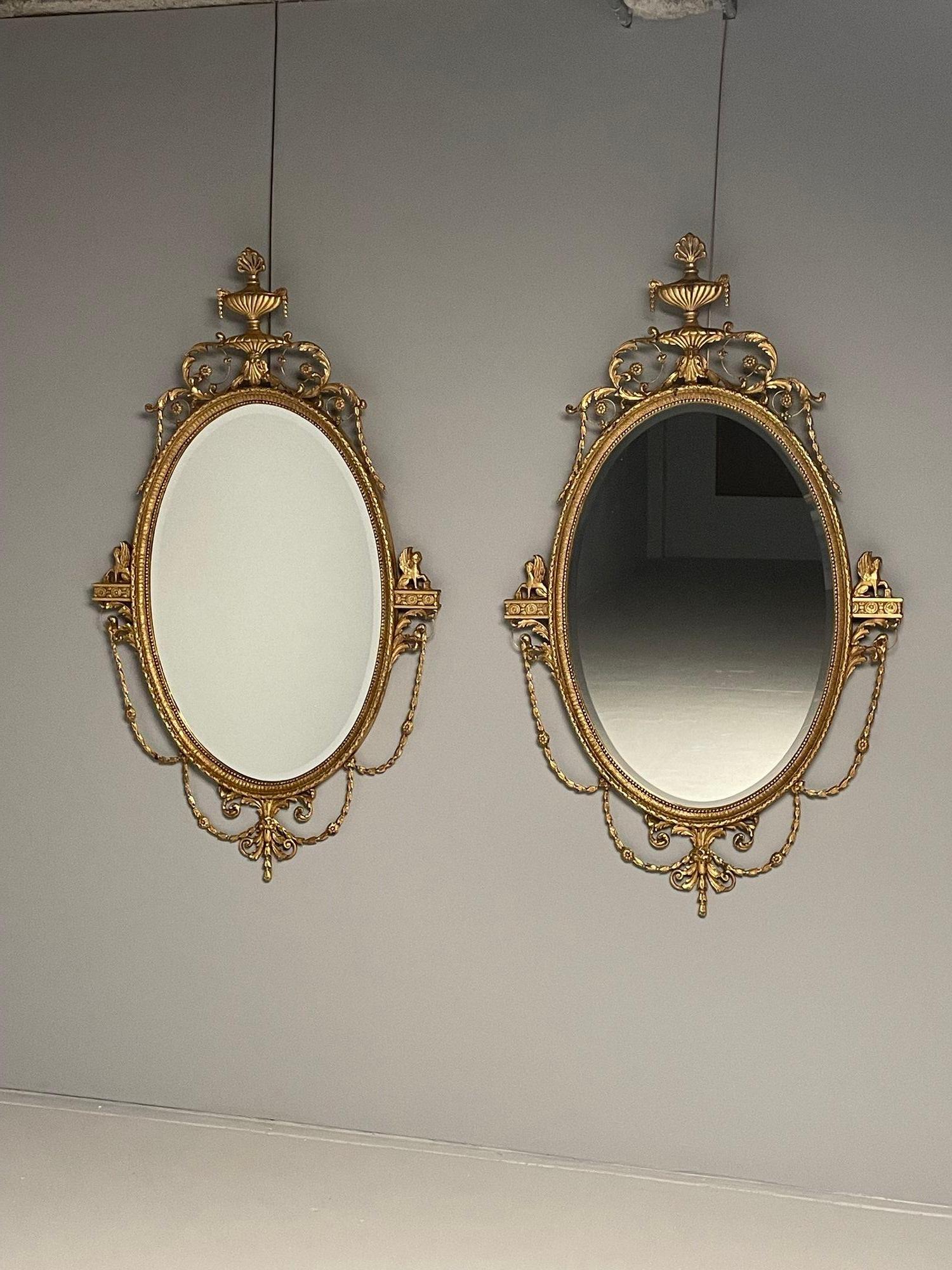 20ième siècle Miroirs muraux ovales de style Régence anglaise Friedman Brothers, bois doré et gesso en vente