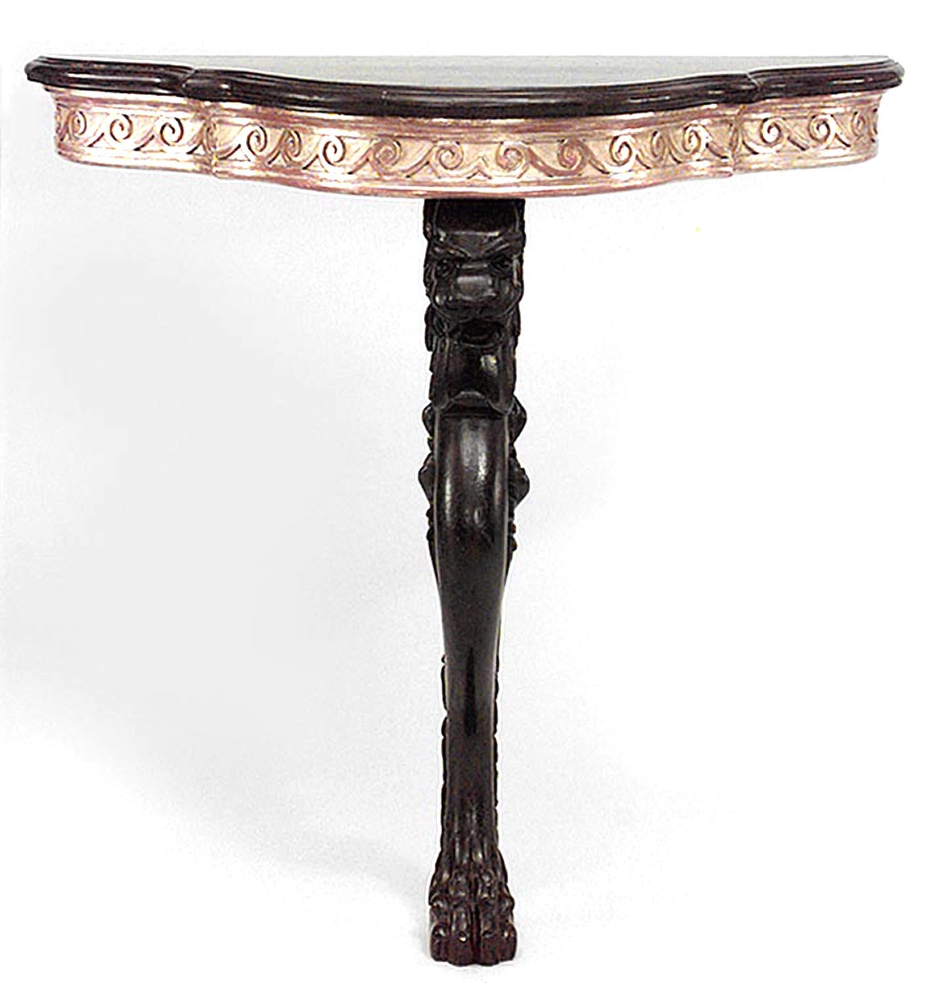 Pair of English Regency style (19th century) painted lion leg bracket console tables with gilt apron and shaped faux porphyry top.
 