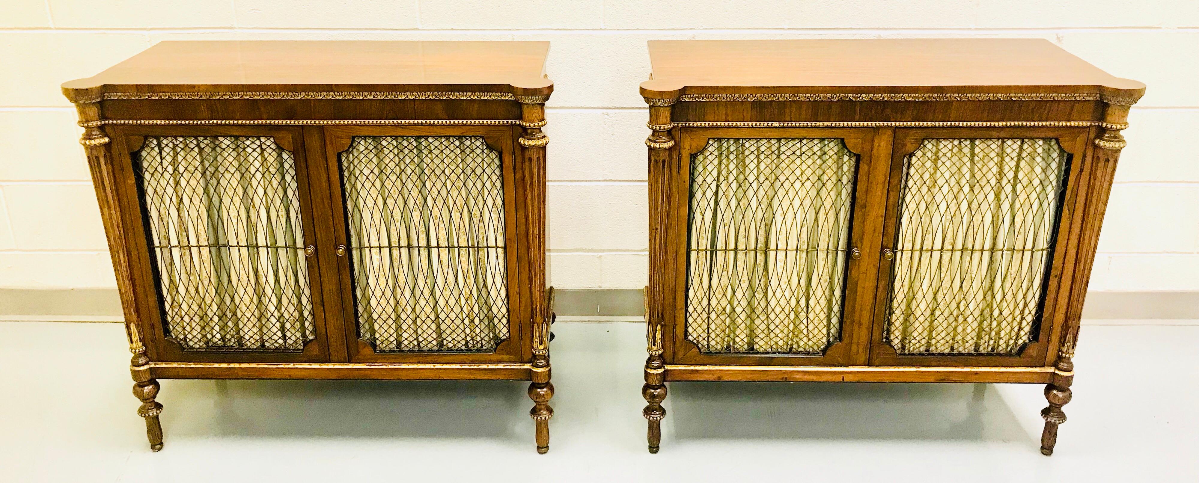 Pair of English Regency style rosewood and parcel-gilt cabinets.