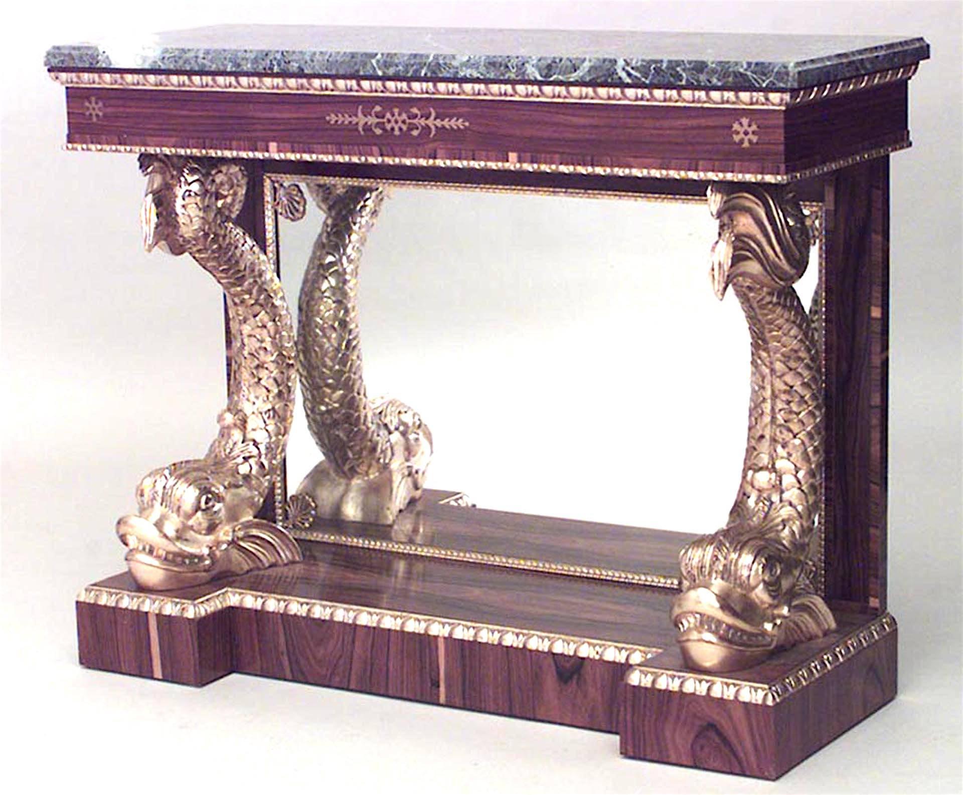 Pair of English Regency-style rosewood console tables with brass inlaid front apron supporting two gilt carved dolphins resting on platform base with mirror back and marble top. (Related item: 056500C) (PRICED AS Pair)
