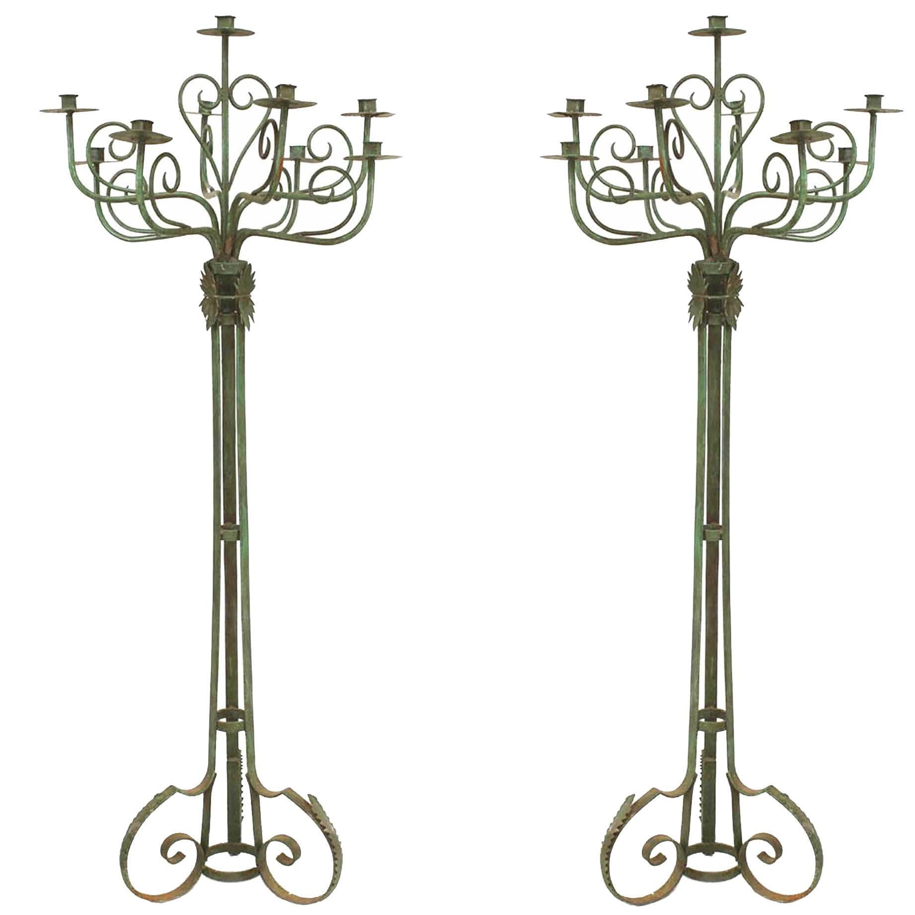 Pair of English Renaissance Patinated Wrought Iron Floor Torchieres For Sale