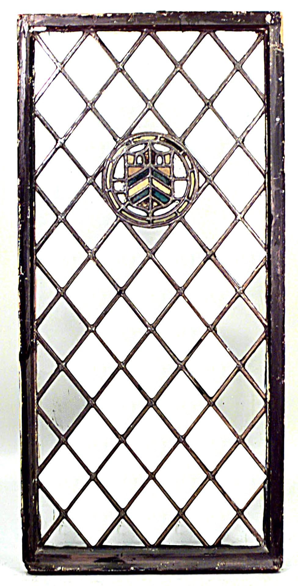 Pair of English Renaissance style (19th Century) large leaded glass window panels with center medallion.
