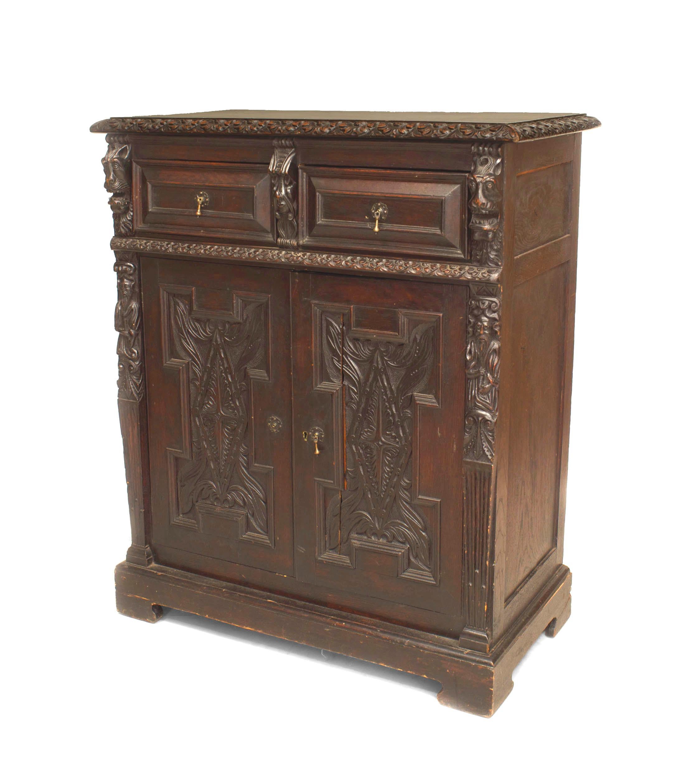 Pair of English Renaissance style (19/20th Century) dark stained oak carved 2 door sideboard cabinets with Wainscot panels and drawer (PRICED AS Pair).
