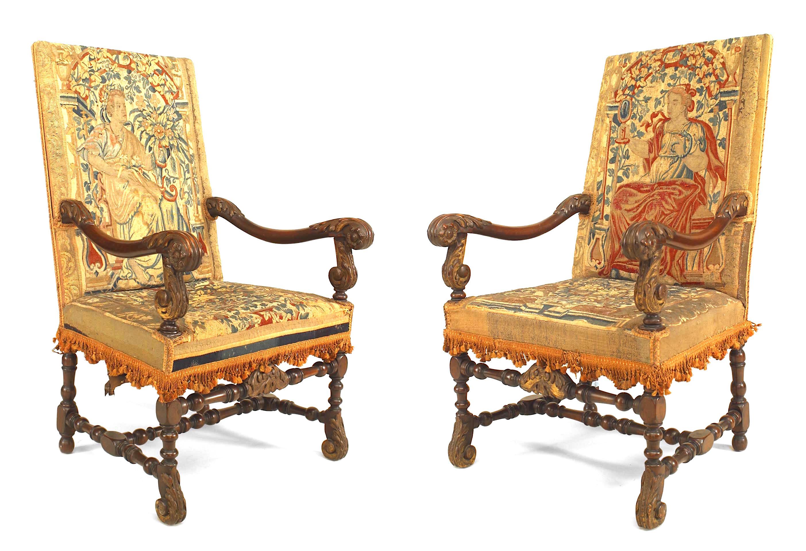 Pair of English Renaissance style (19th Cent) walnut carved open Armchairs with 17/18th Cent tapestry upholstered seat and square back with a stretcher connecting the legs.
