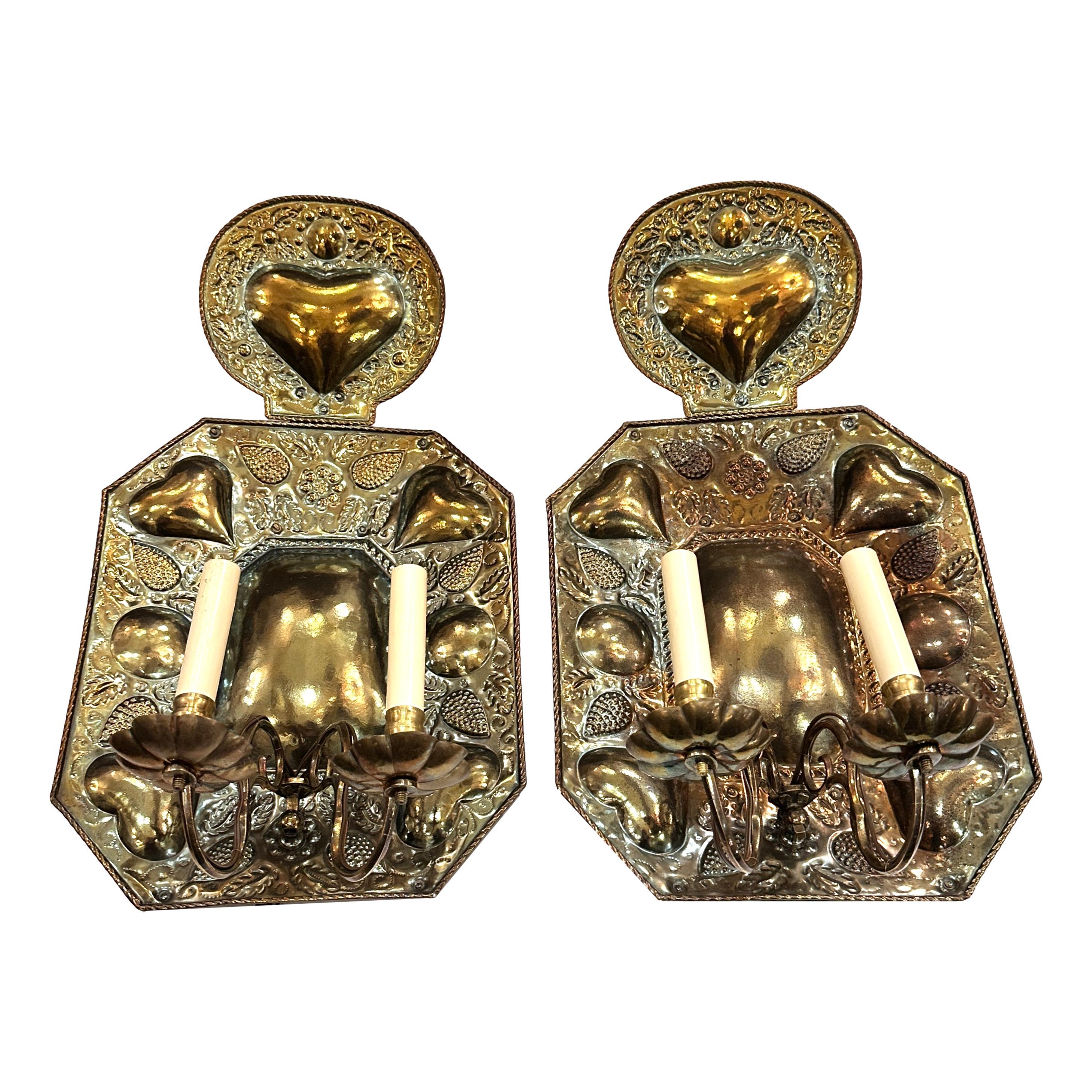 A pair of large circa 1920's English hammered sconces.

Measurements:
Height: 24