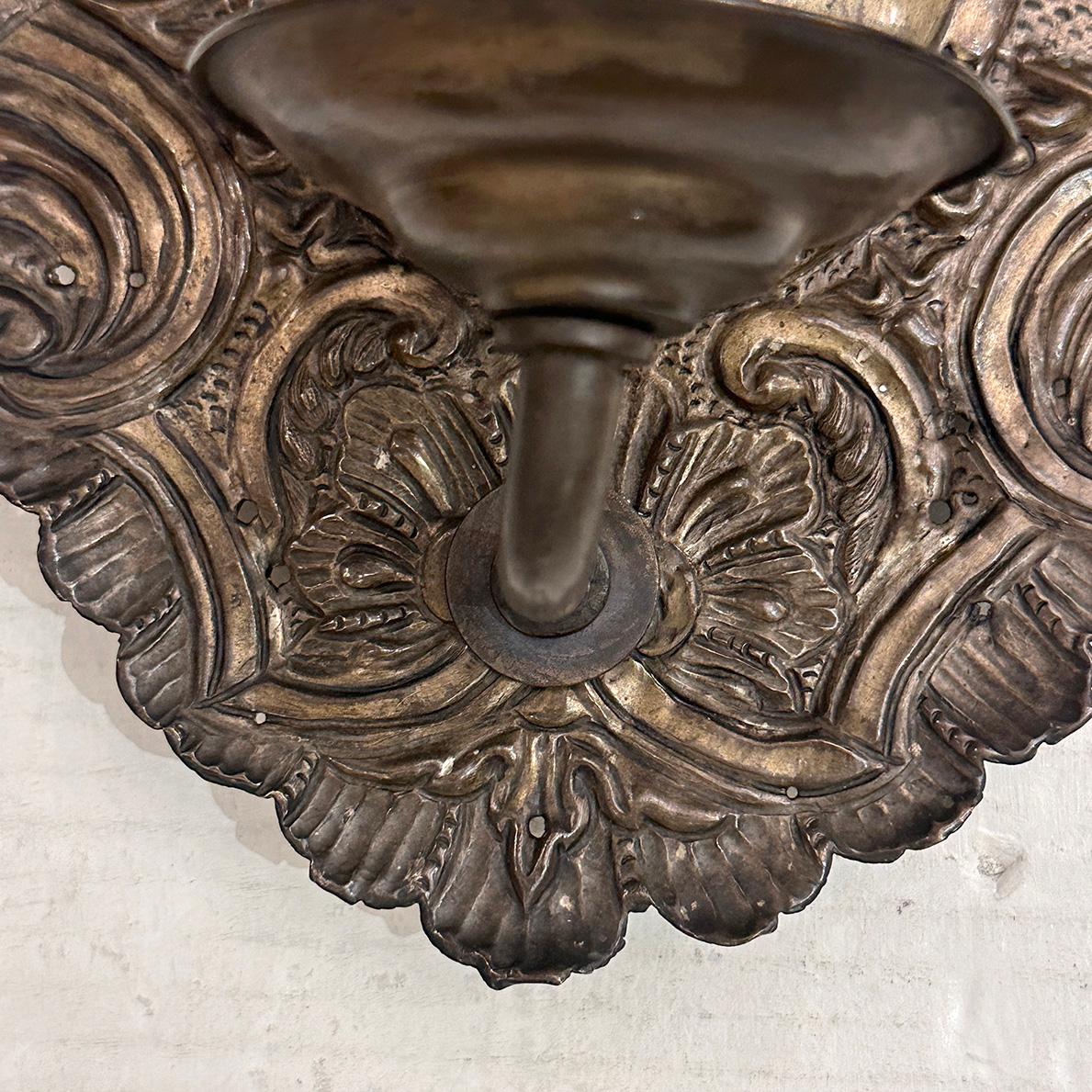 Metal Pair of English Repousse Sconces For Sale