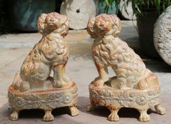 Pair of English Saltglaze Spaniels on Oval Bases, Briddon Pottery, 1830