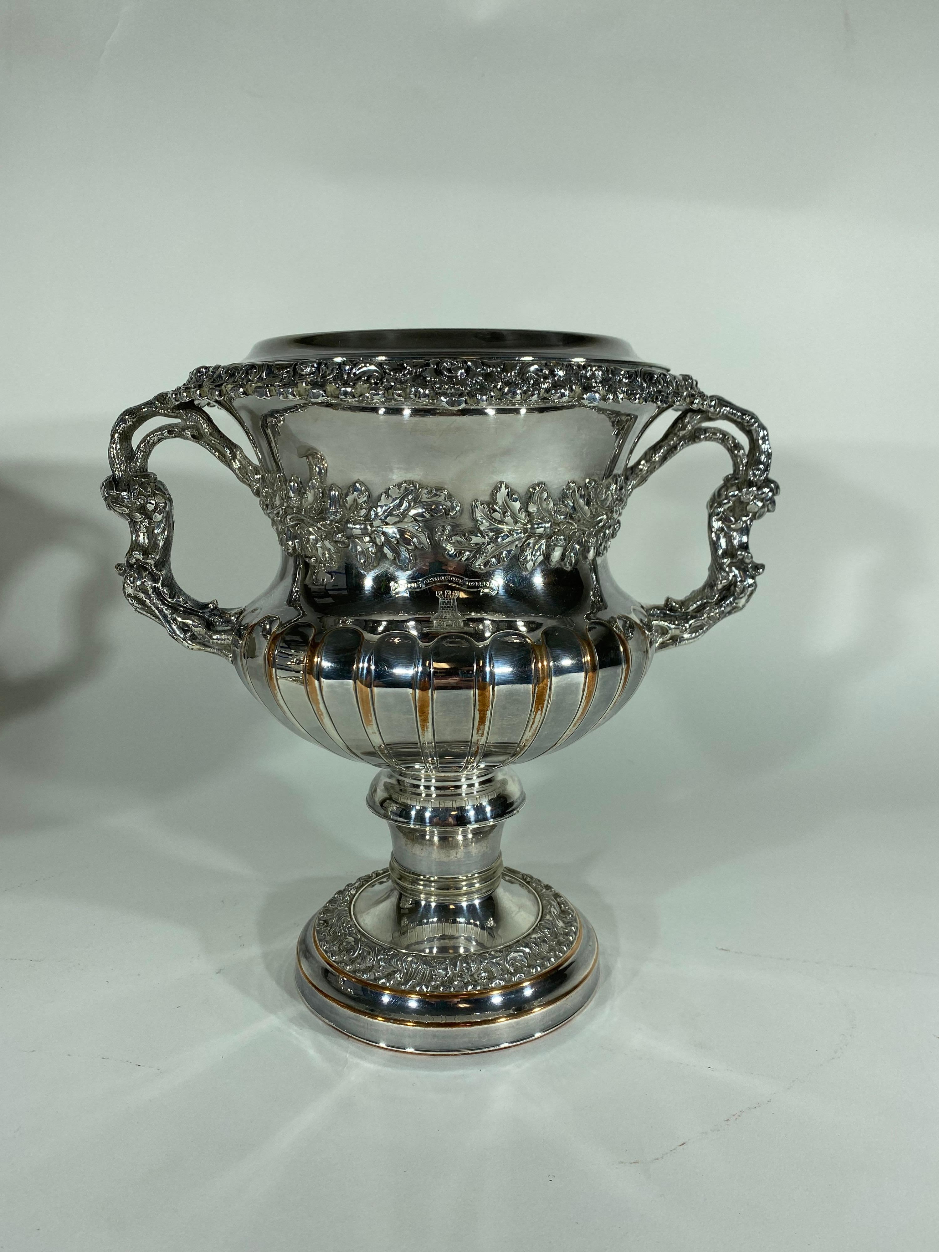 Pair of Sheffield silver over copper wine coolers with amoroso crests. Handled urn form with exceptional casting. Copper showing through on ridges on main body.