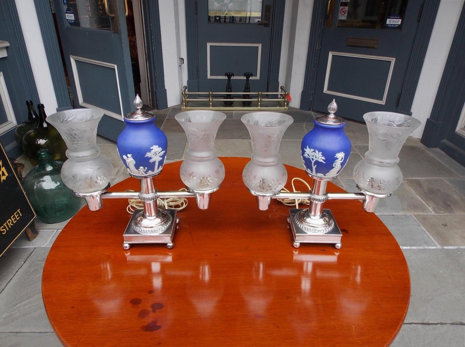 Pair of English Sheffield and Wedgewood figural solar lamps with the original frosted etched foliage and berry shades. Early 19th century. Pair of lamps have been electrified.