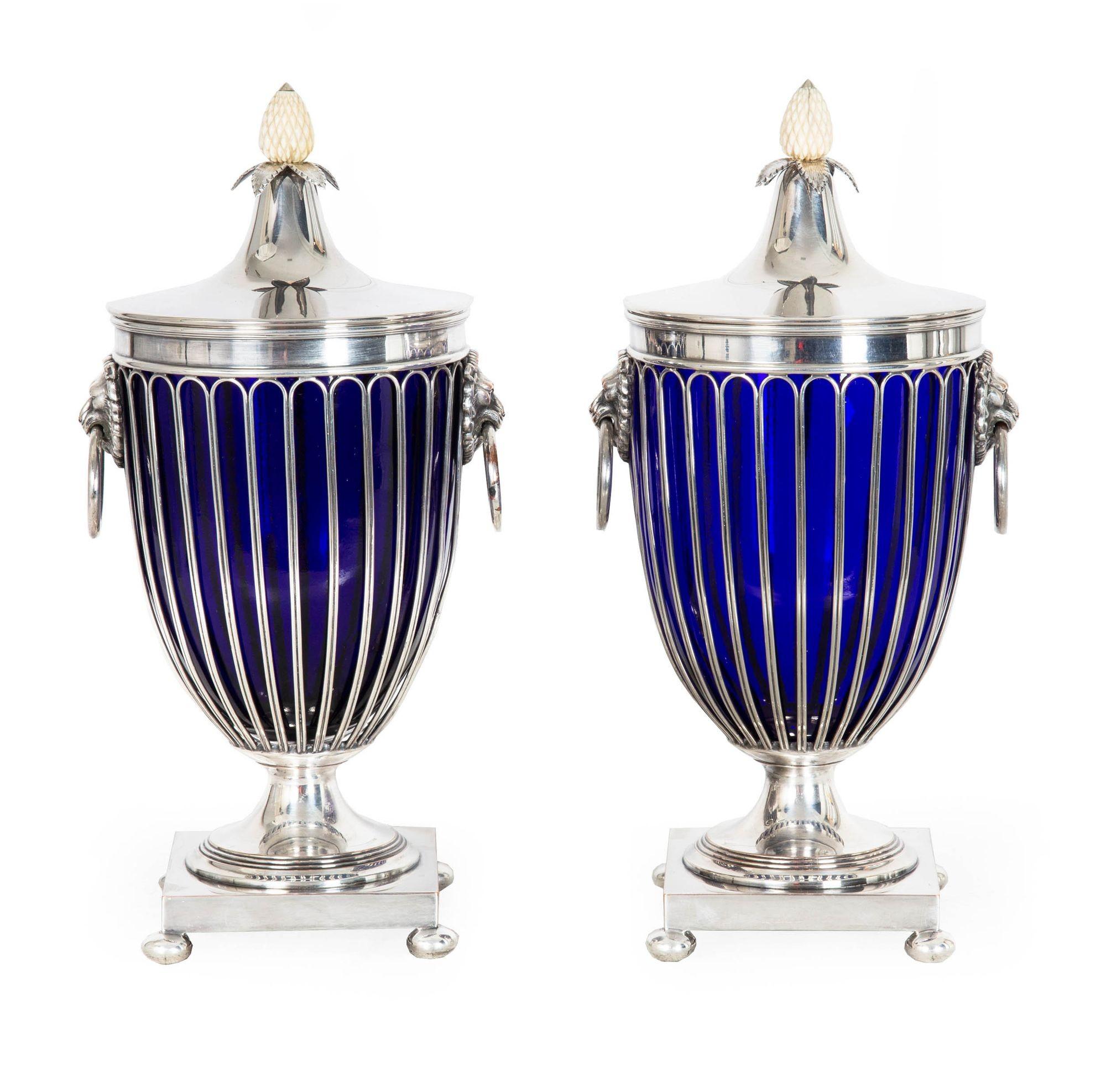 VERY FINE PAIR OF ENGLISH SILVERPLATED COBALT GLASS CHESTNUT URNS
Marked for Barker-Ellis of Birmingham, England  made circa 1912-1931  with maker's mark to underside [seven-branch menorah], signed 