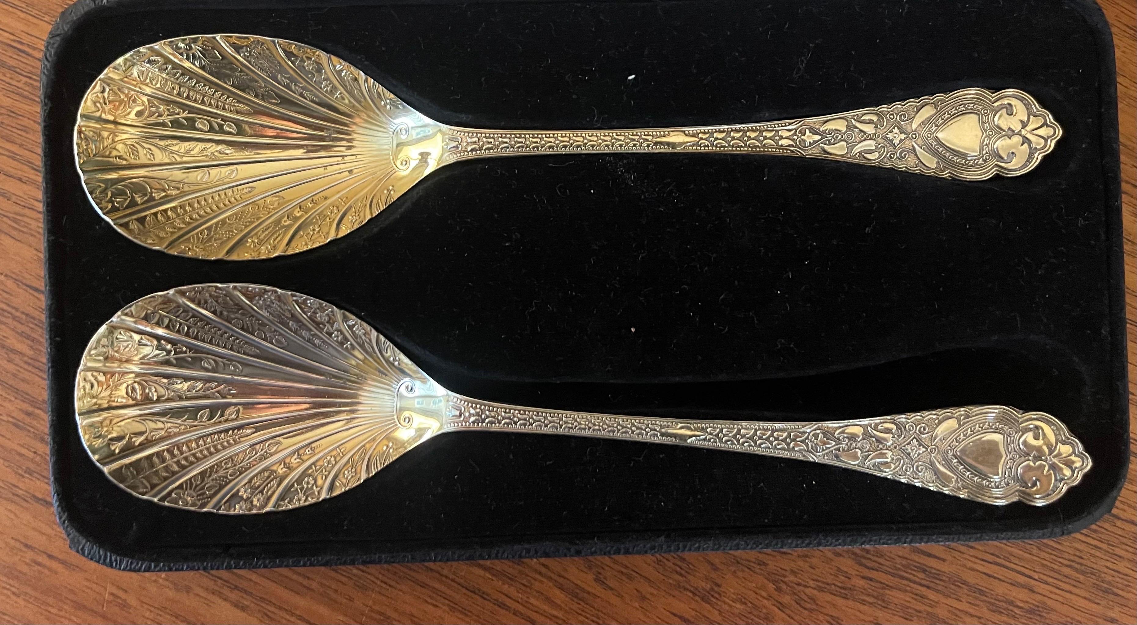 Elegant pair of Sheffield silver plated serving spoons in custom box by I. Magnin, circa 1940s. The spoons are in very good vintage condition and and measure 9