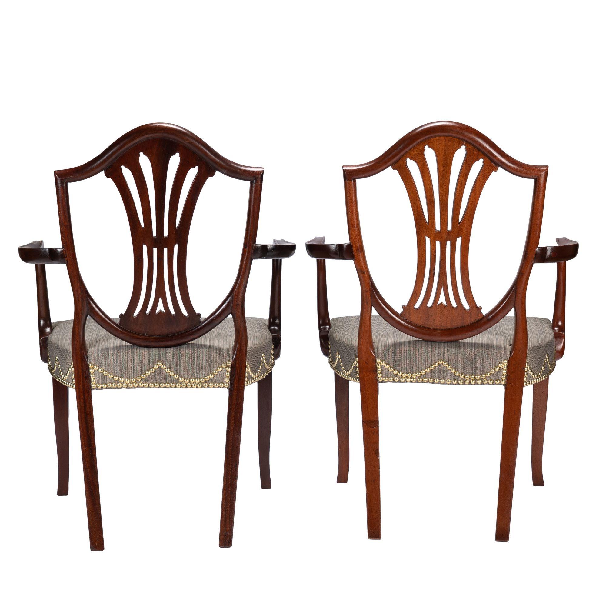 Brass Pair of English Sheraton mahogany shield back armchairs, 1790 For Sale