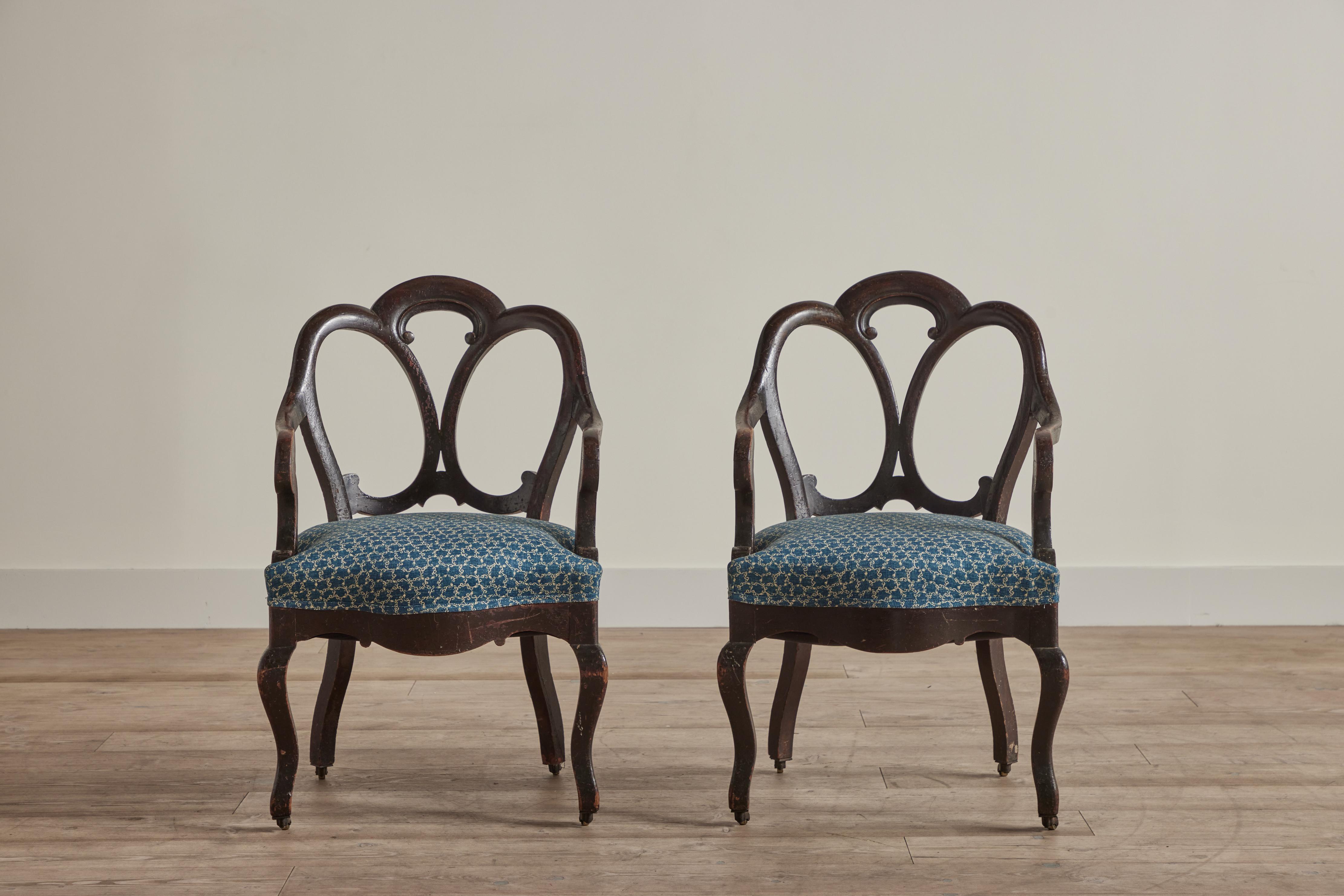 Pair of late 19th century wood side chairs from England with new upholstery in Robert Kime’s “Te Blue” fabric. Chairs have metal wheels on the feet. Visible wear on wood frame that is consistent with age and use. 