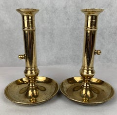 A Pair of Side Ejector Brass Chambersticks-England, Late 18th c.