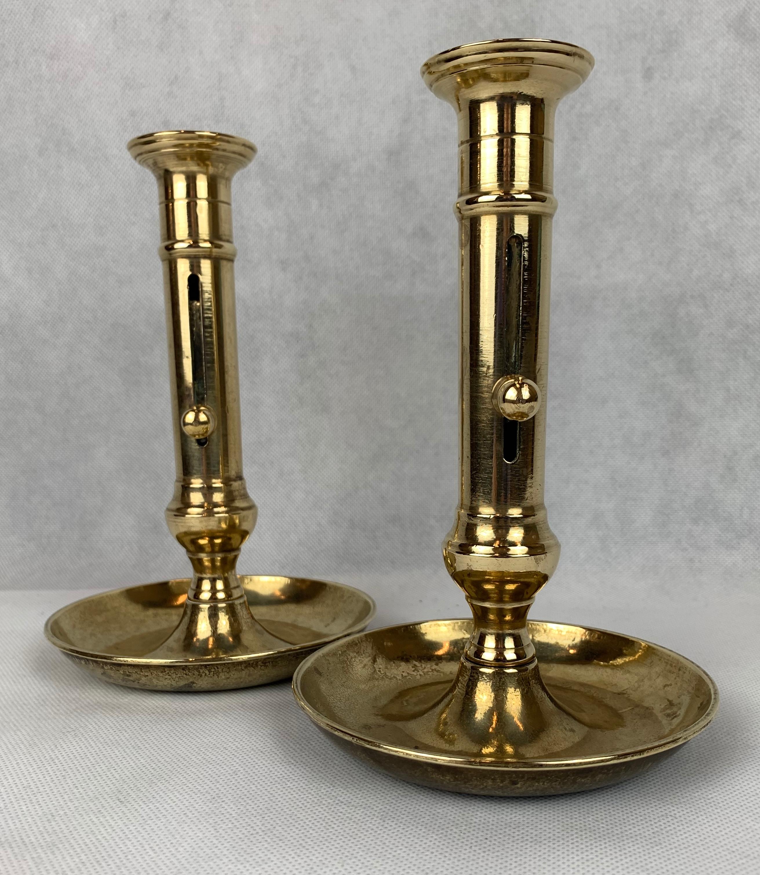 Georgian A Pair of Side Ejector Brass Chambersticks-England, Late 18th c. For Sale