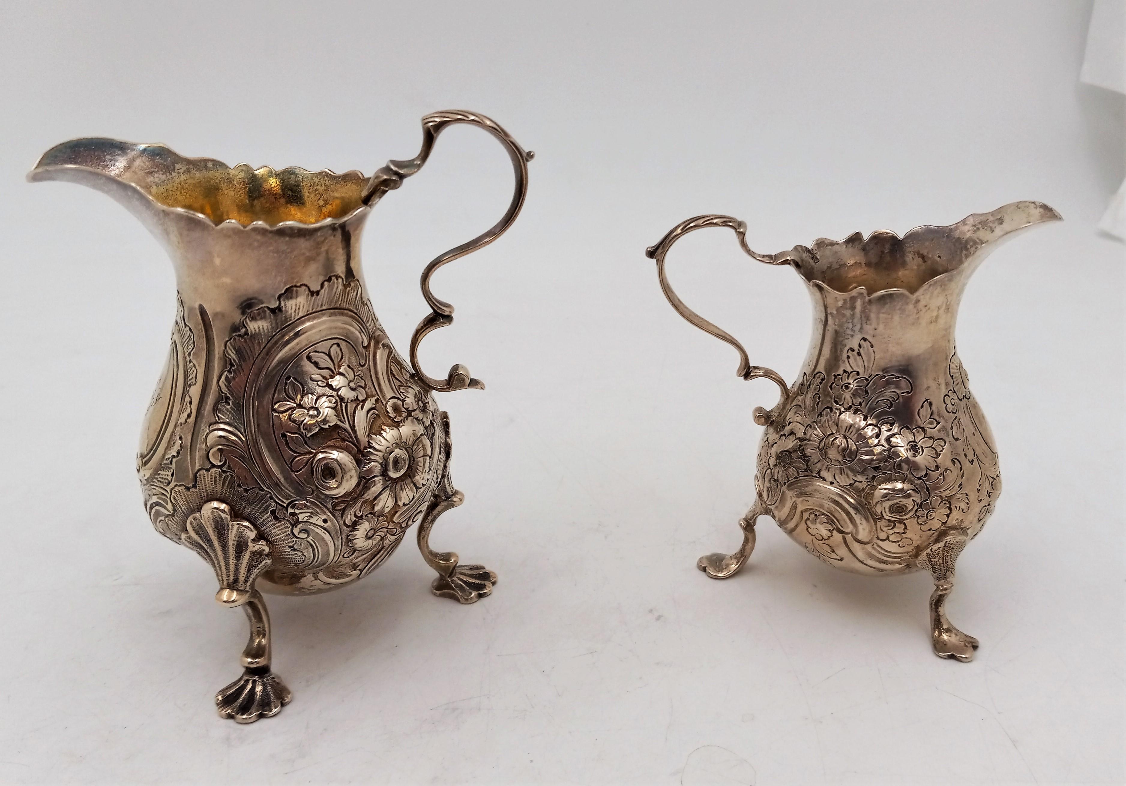 19th Century Pair of English Silver Georgian Cream Pitchers on Shell Legs with Floral Pattern For Sale