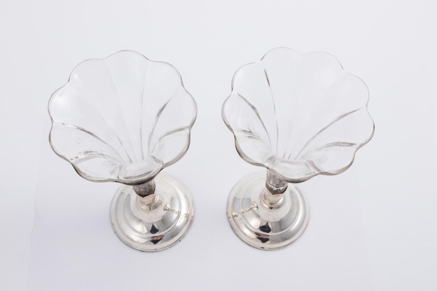 Pair of English glass fluted vases in silver plate stands, circa 1930s.