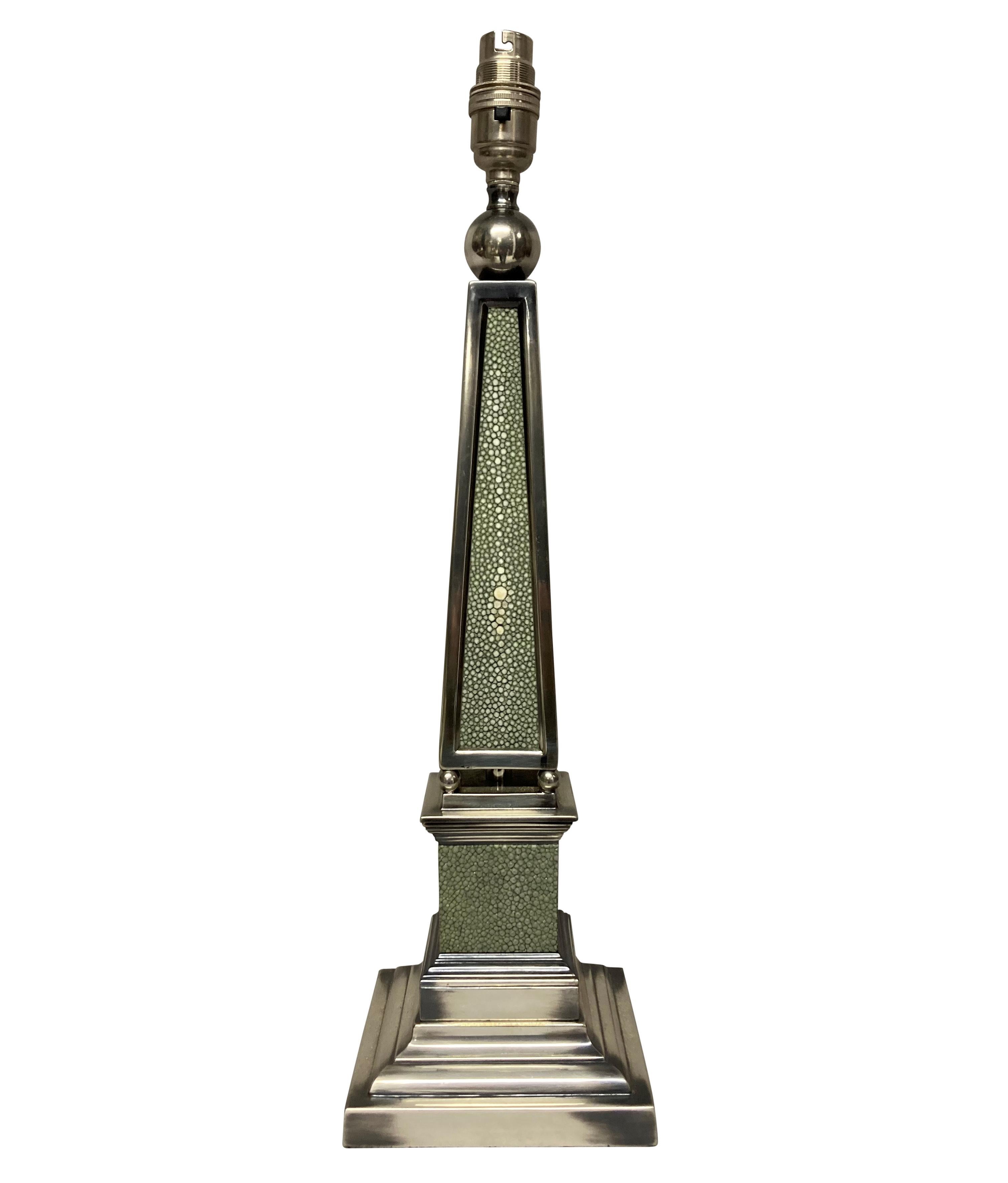 A pair of English silver-plated obelisk lamps of neo-classical design, covered in antique shagreen. Newly electrified with silk cord and in-line switches.