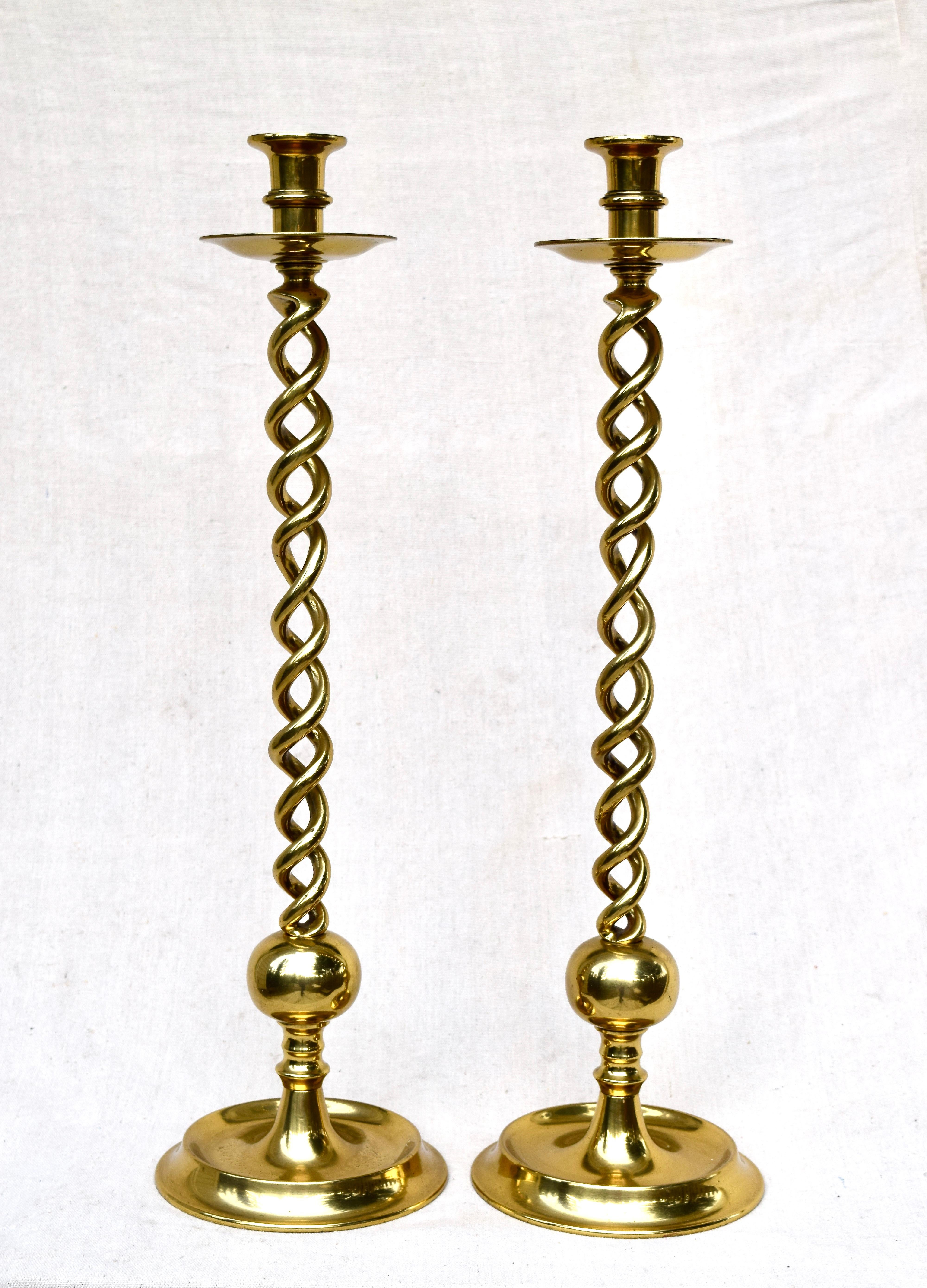 An impressive pair of heavy solid brass open barley-twist candlesticks, early 20th century generous in height at a full 23