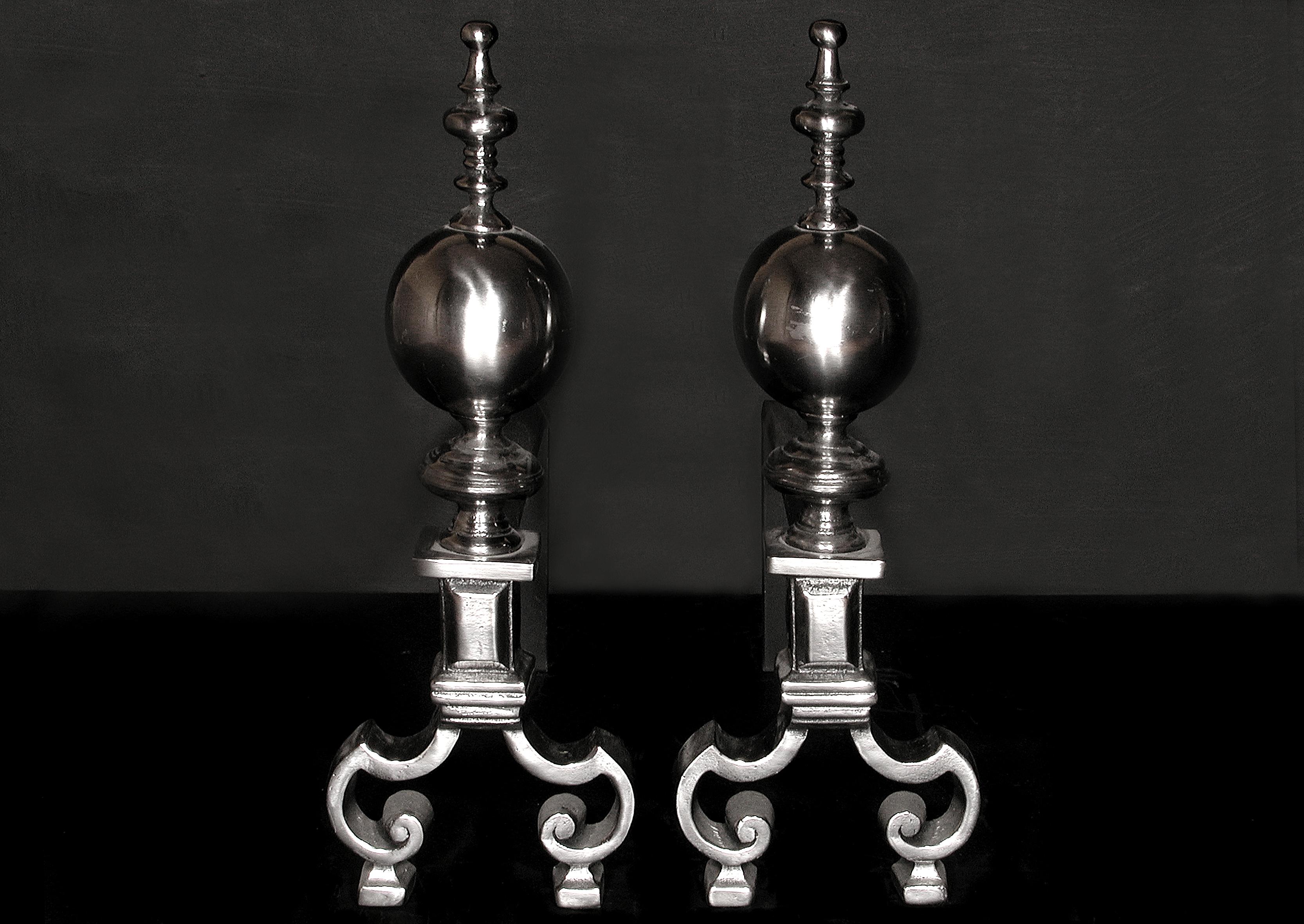 Pair of English steel firedogs, with ball and finial top and breakleg base. 

N.B. May be subject to an extended lead time.

Measures: 
Height:	490 mm      	19 1/4 in
Width:	170 mm      	6 3/4 in
Depth:	630 mm      	24 3/4 in