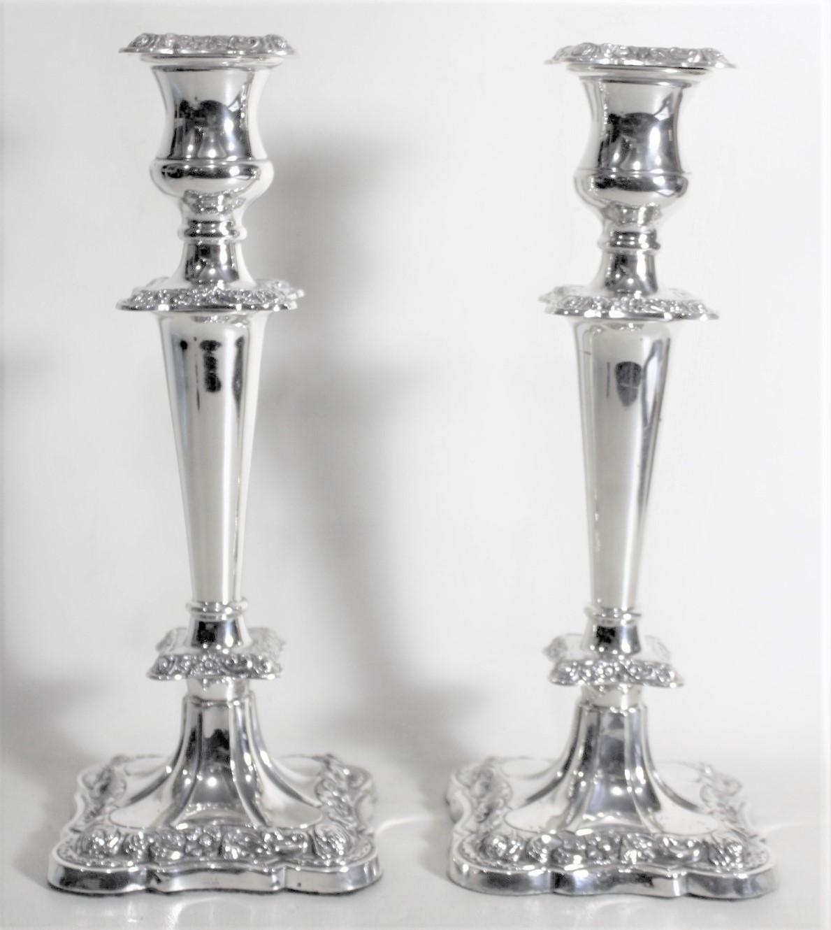 Molded Pair of English Sterling Silver Candlesticks with Chased Floral Decoration