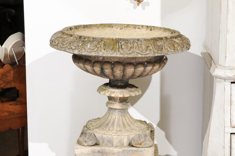 Pair of English Stone Garden Urns on Pedestals with Laurel Wreaths and Gadroons In Good Condition For Sale In Atlanta, GA