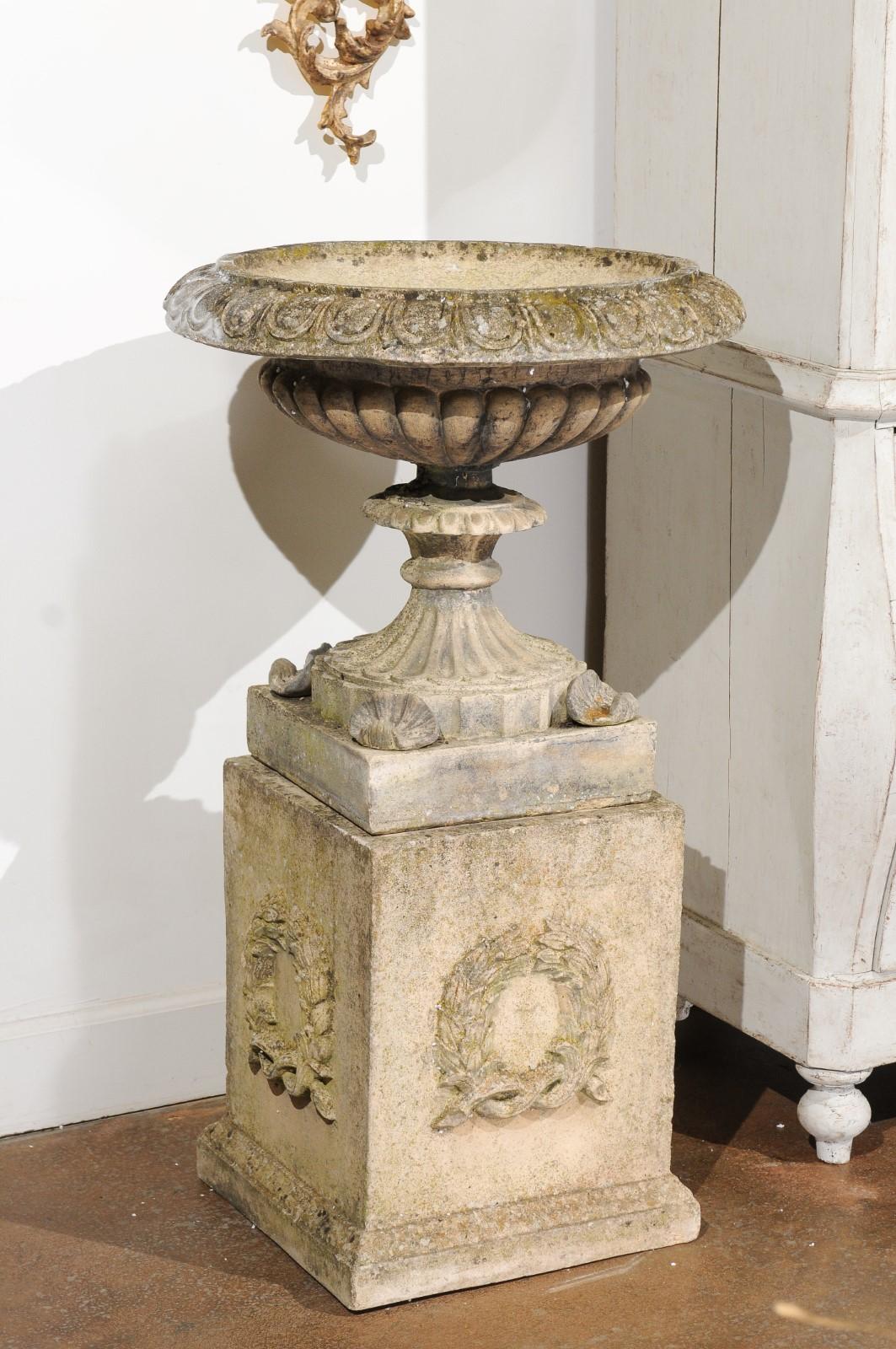 Pair of English Stone Garden Urns on Pedestals with Laurel Wreaths and Gadroons In Good Condition In Atlanta, GA