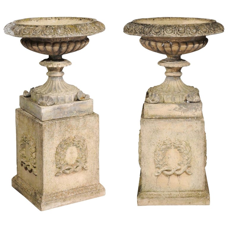 Pair of English Stone Garden Urns on Pedestals with Laurel Wreaths and Gadroons For Sale