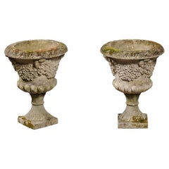 Pair of English Turn of the Century Stone Garden Urns with Carved Floral Décor