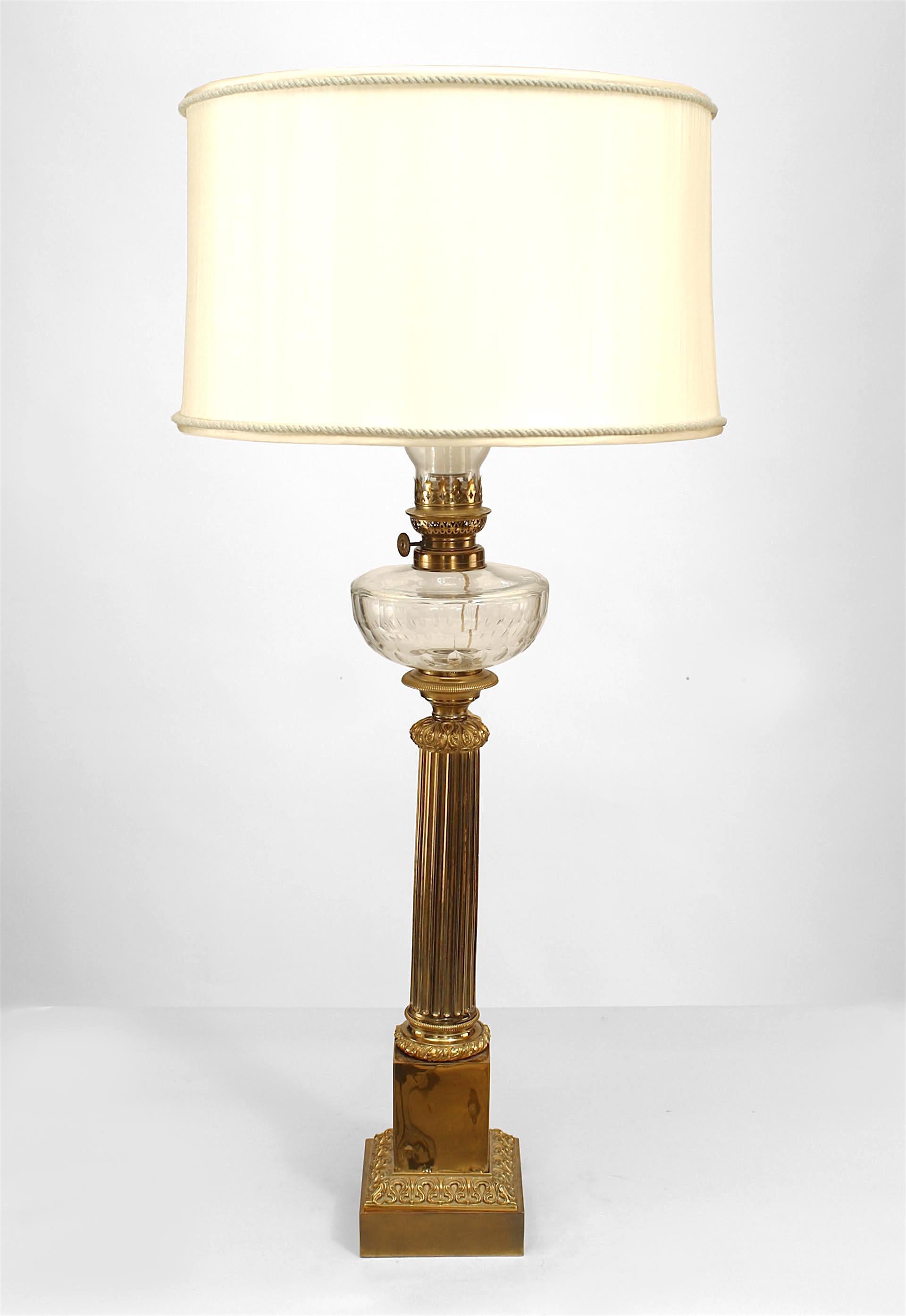 Pair of English Victorian brass fluted column table lamps with crystal fount and square base (PRICED AS Pair).

