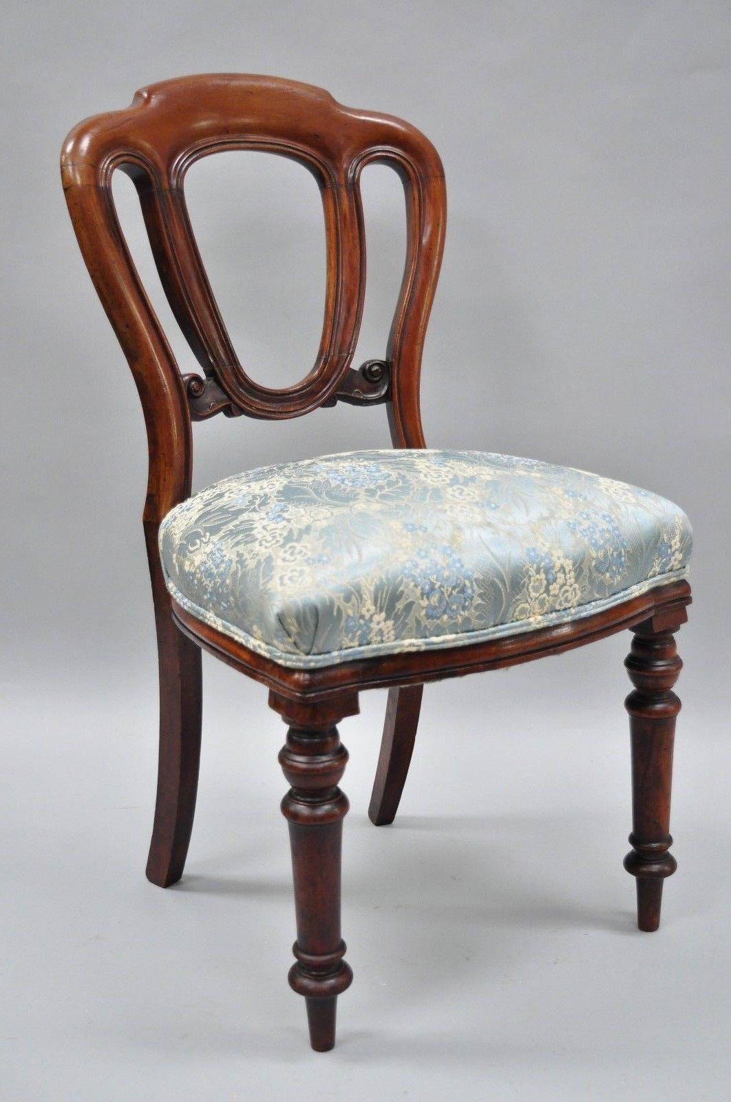 Pair of antique 19th century English Victorian solid mahogany chairs. Listing includes authentic warm patina, turn carved legs, heavy solid wood construction, beautiful wood grain, upholstered seats, nicely carved details, circa 19th century.