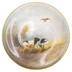 Paire de plaques murales anglaises victoriennes en porcelaine représentant une scène de chasse