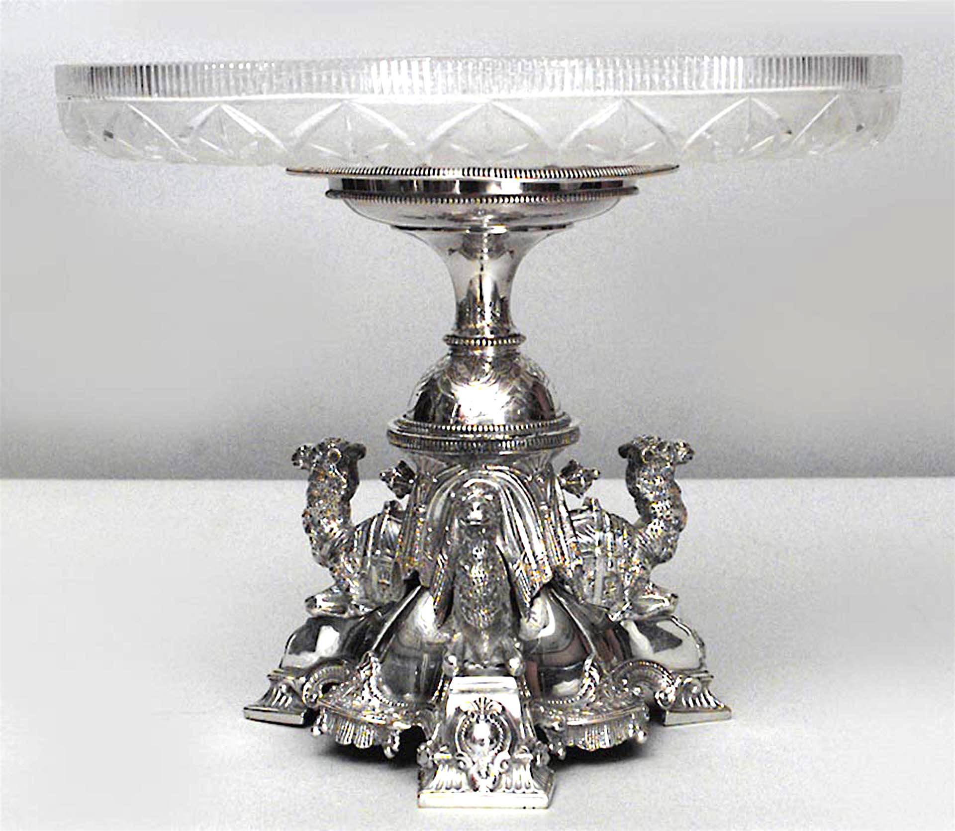 Pair of English Victorian (Dated 1865) silver plated centerpieces with camels kneeling on the tripartite base beneath a cut-glass dish (PRICED AS Pair)

