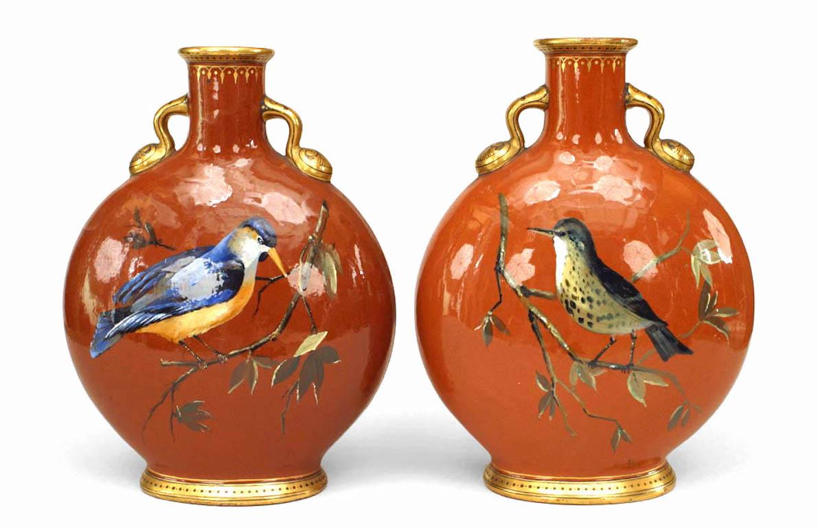 Pair of English Victorian style rust ground porcelain Pilgrim flask vases with gilt accents & painted with birds & floral clasps (Minton, 1948) (PRICED AS Pair)
