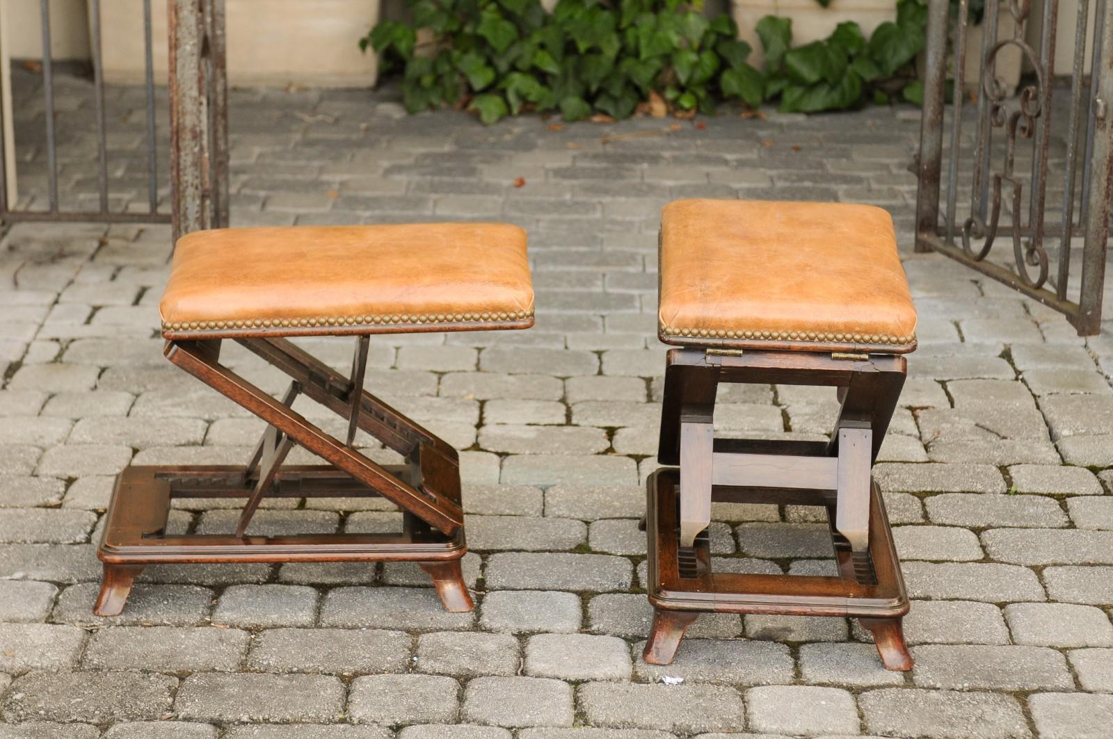 A pair of English wooden metamorphic footstools from the mid-19th century, with caramel leather tops. Born in England during the third quarter of the 19th century, each of this amazing metamorphic stools features a caramel colored leather top,