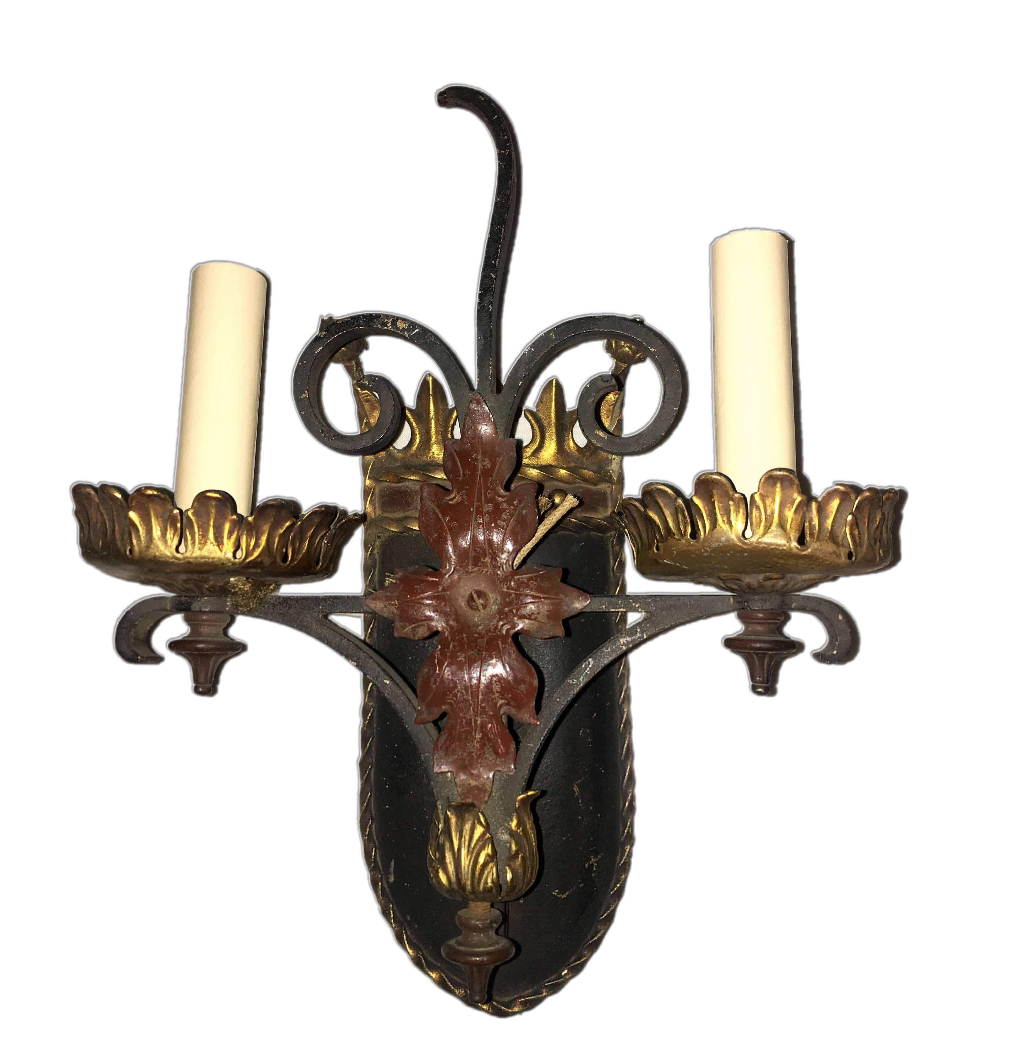 Pair of English circa 1940s hammered wrought iron sconces with painted and gilt finish.

Measurements:
Height 11.5