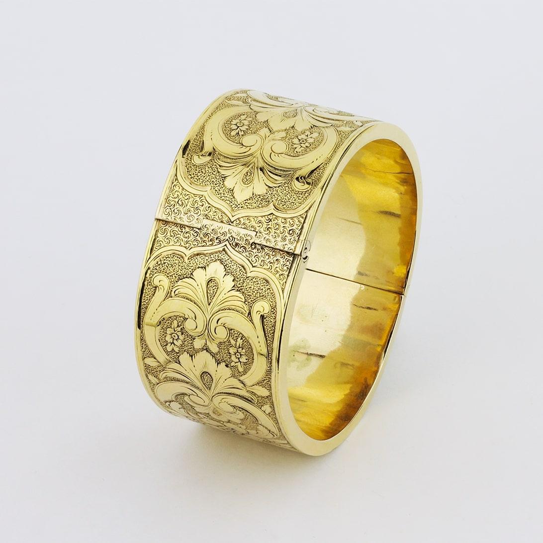 The details in this pair of 19th century gold wedding cuffs are beyond intricate, with all of the exterior precisely engraved. Both cuffs are in excellent condition for their age and their original tongue and box clasps work well and are secure.