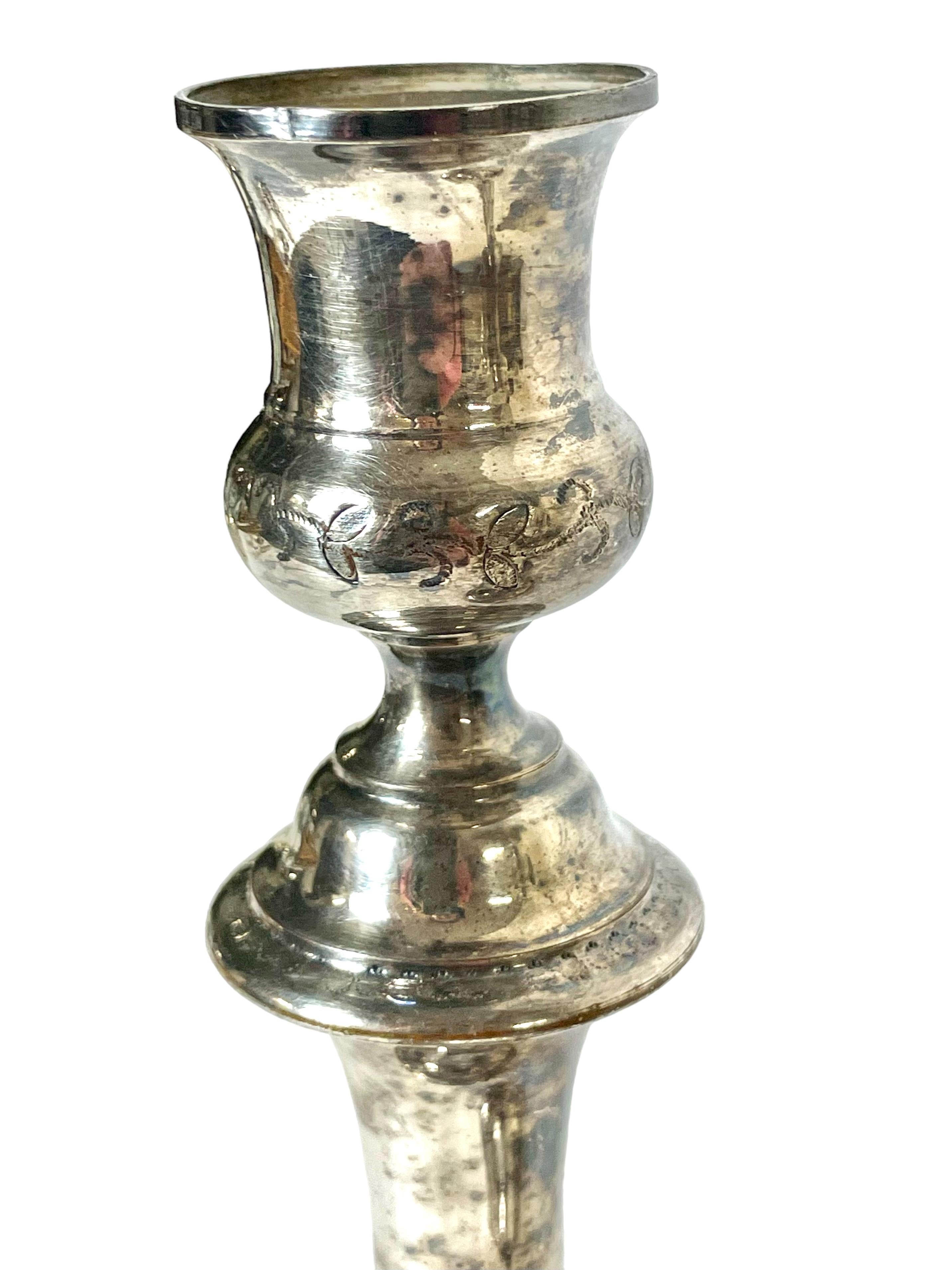 An exceptionally fine pair of silver-plated candlesticks by renowned silversmiths Cailar Bayard. Founded in Paris by Noël Cailar and Pierre Bayard, the firm produced top-notch silverware from 1845 until they closed in 1934. This beautiful example of