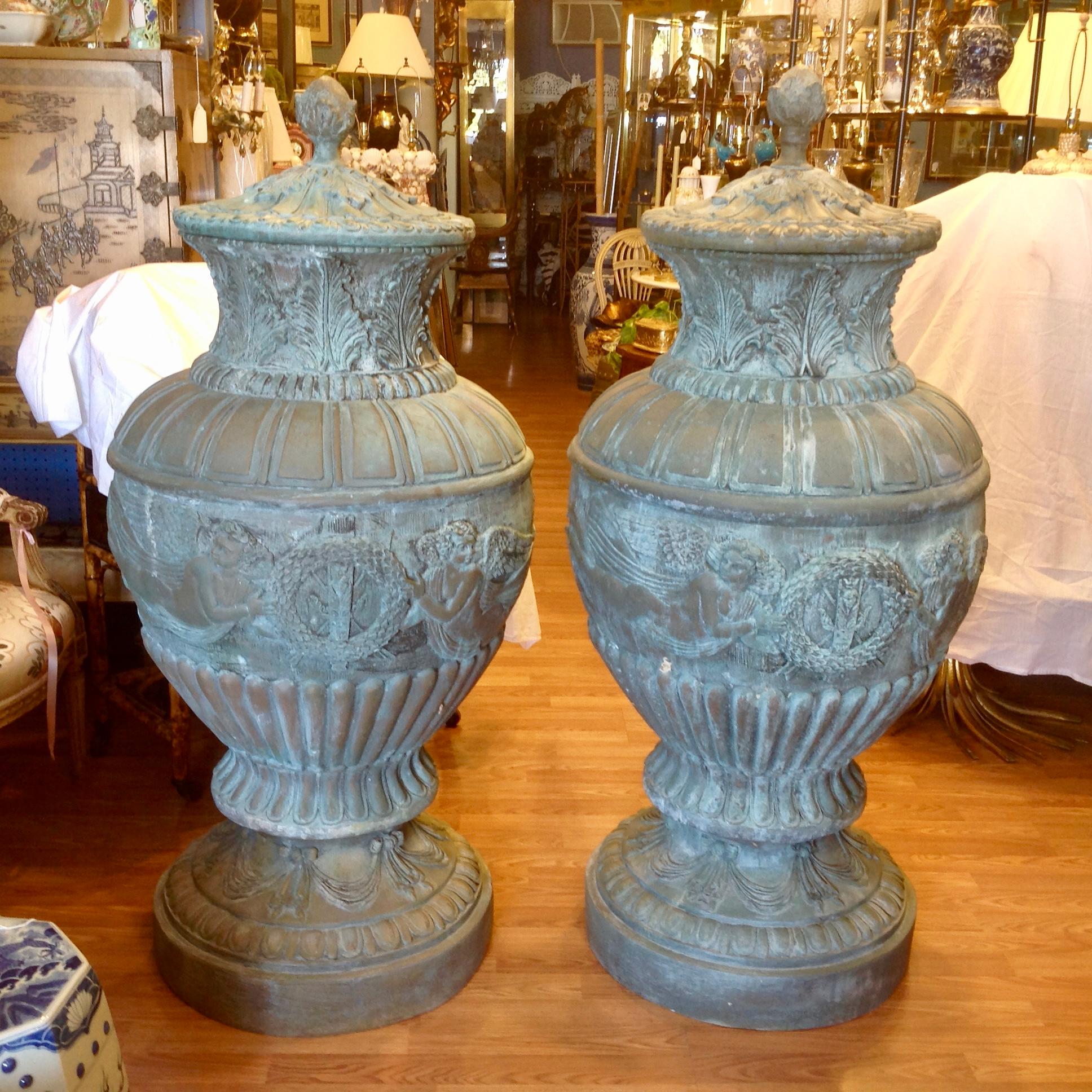 Magnificent detail, scale, and proportions.
The urns are fashioned with neoclassic winged figures, wreaths, and florals.
The Verde Gris patina is varied from outside use - cast in solid bronze.
(The lids are removable).