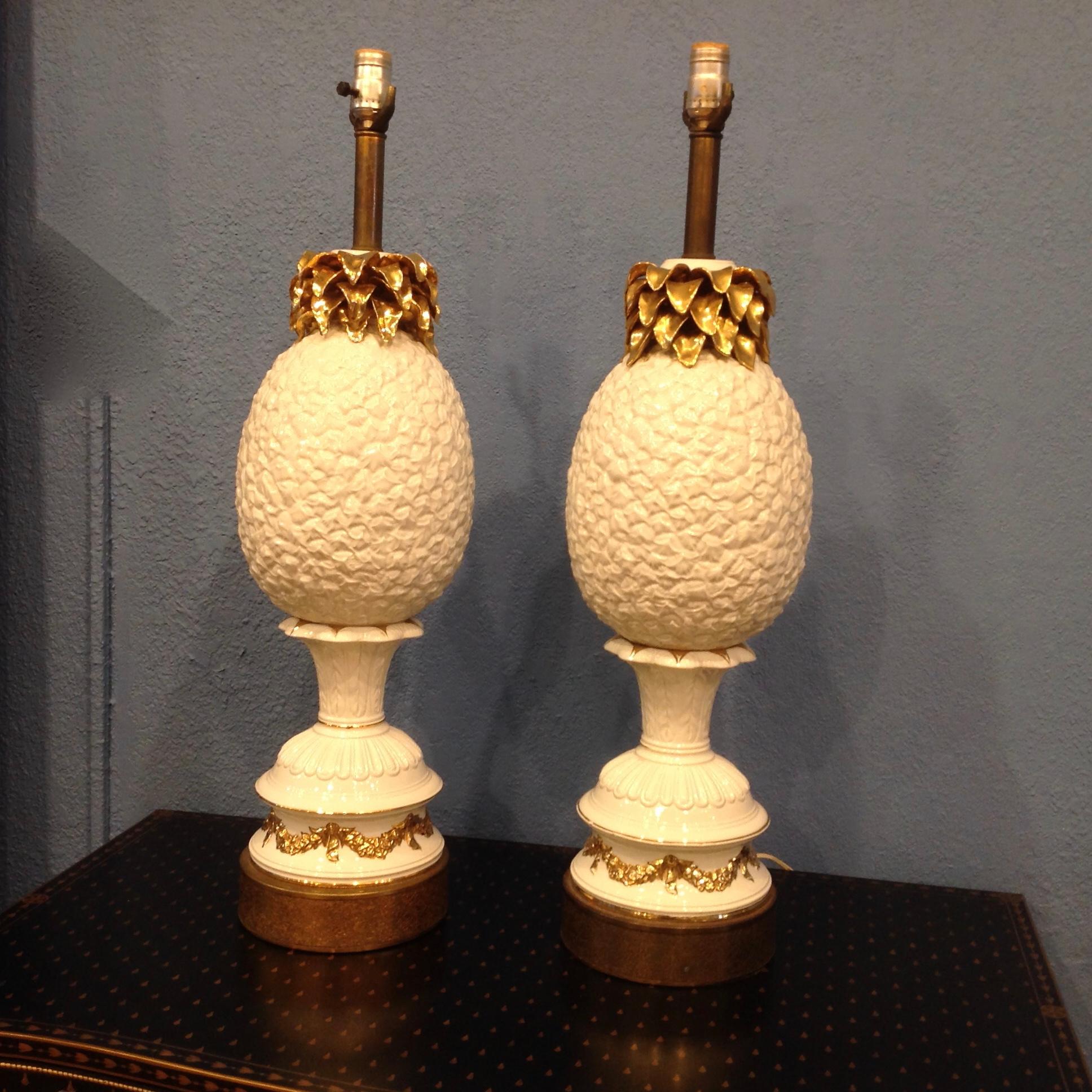 This visually stunning pair is attributed to Marbro.
The gold accents add drama to the porcelain.