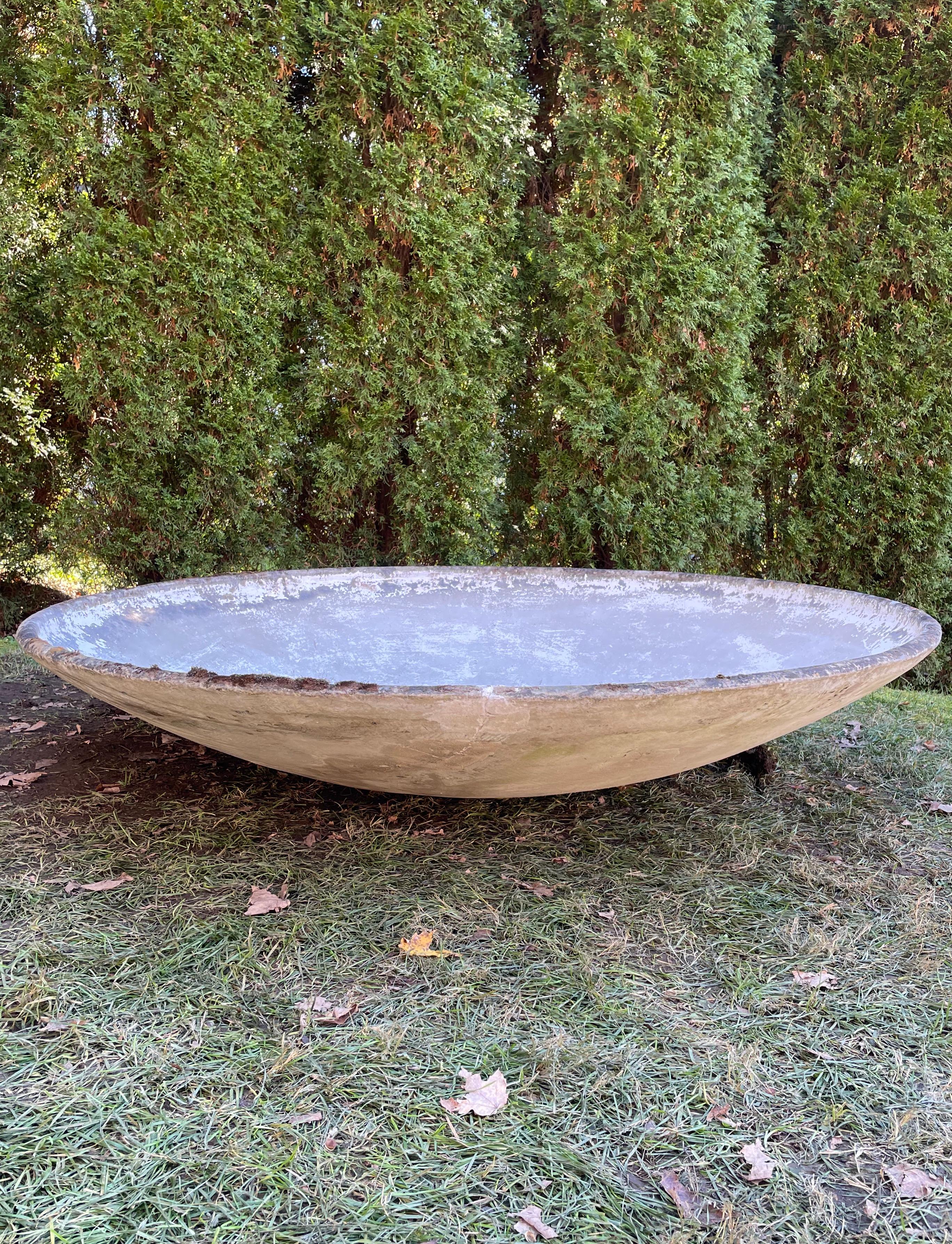 Designed by the iconic Willy Guhl in the 1960s and made of strong and lightweight fiber cement by Eternit, SA of Switzerland, these numbered saucer planters are impressive for their size and patina. One is in excellent condition with only a very