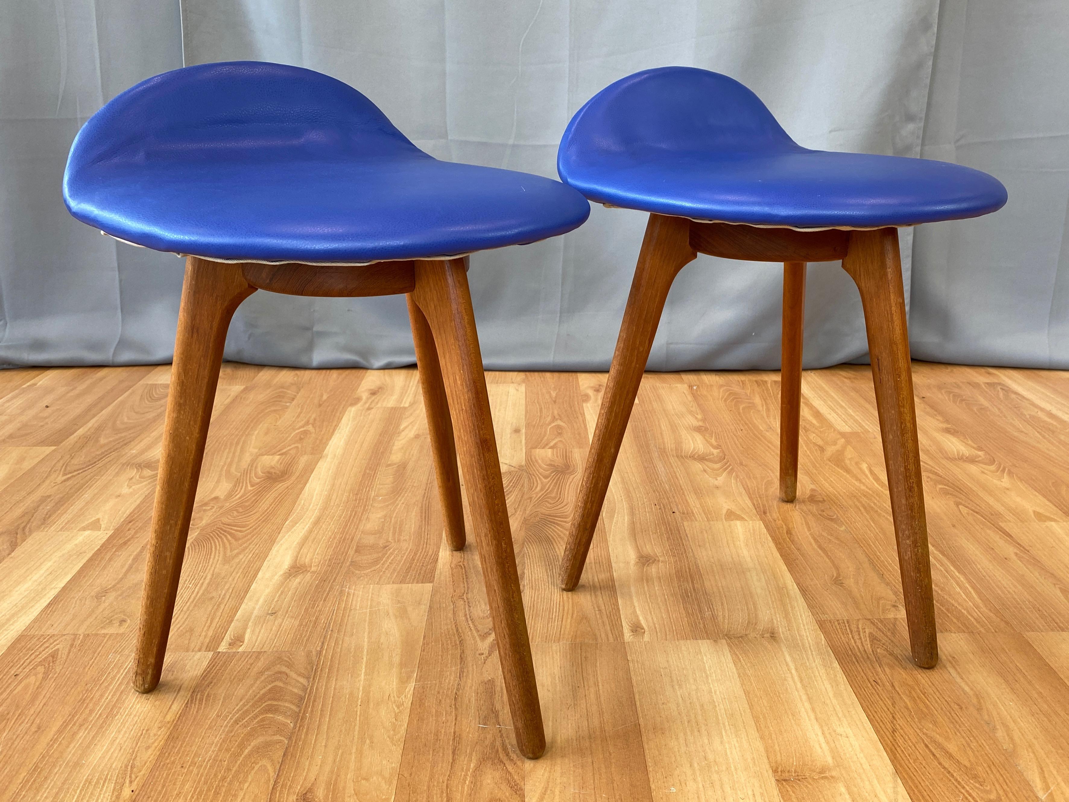 A 1960s pair of rare lounge or cocktail table height model OD-61 teak stools with blue leather upholstery by Erik Buch for Oddense Maskinsnedkeri.

Iconic Danish modern design with clean lines in smoothly crafted solid teak. Distinguished by an