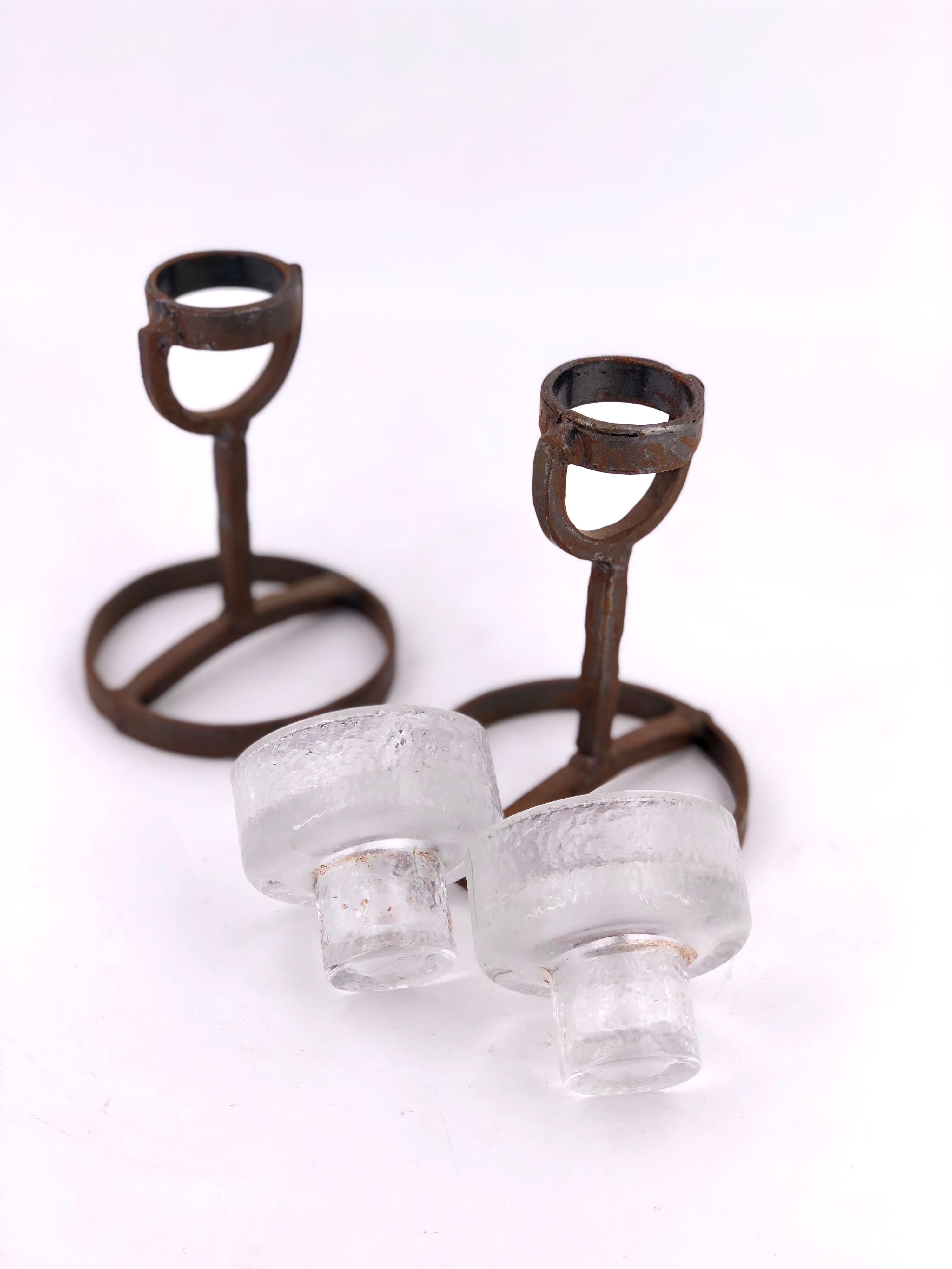 Beautiful pair of candleholders designed by Erik Hoglund for Boda Nova, circa 1950s, an original condition no chips or cracks on the glass, the iron base shows patina due to age.