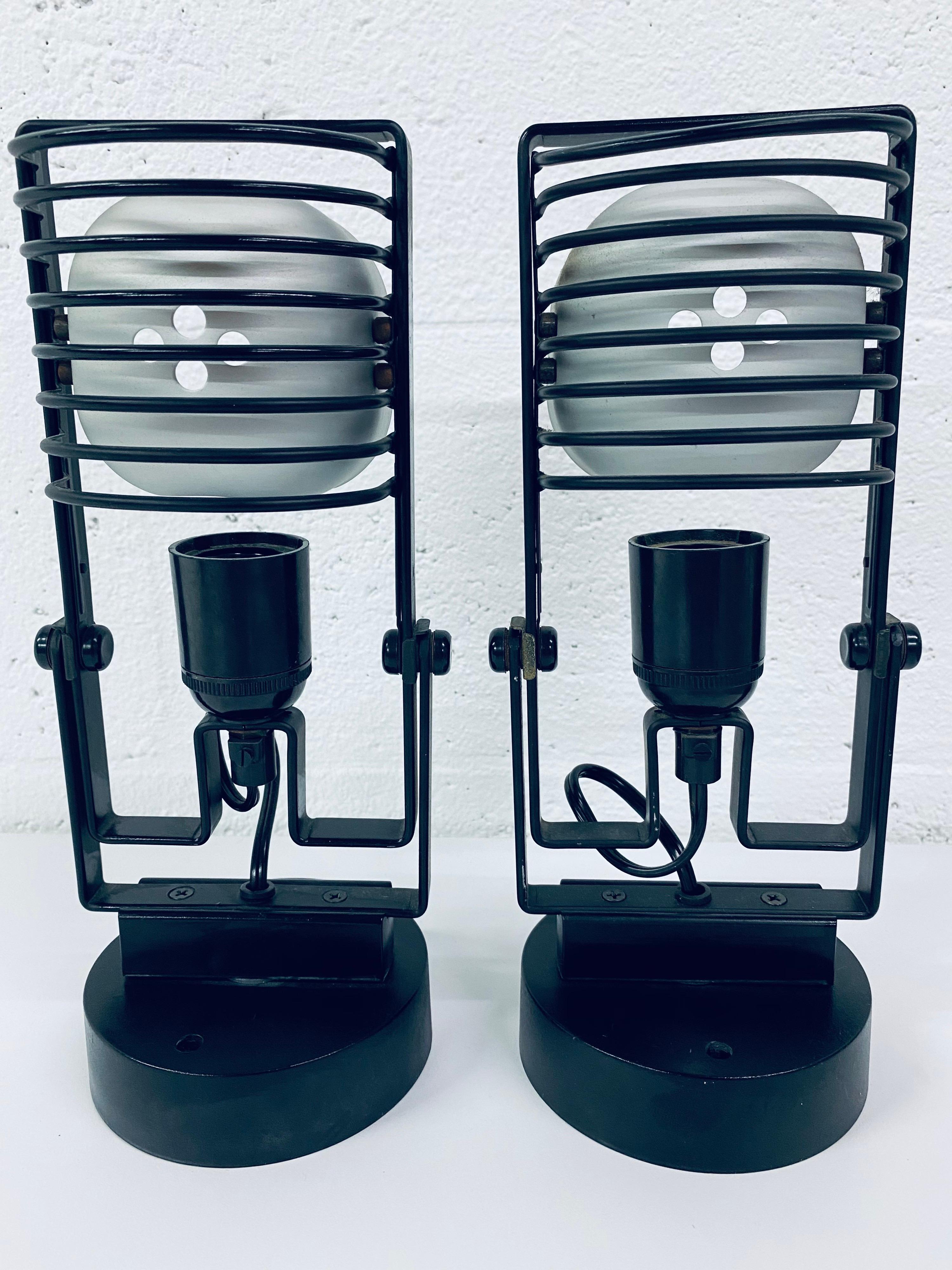 Rare pair of Ernesto Gismondi Sintesi adjustable wall scones for Artemide circa 1970s. Sconces rotate and tilt. No mounting plate required, only screws (not included).