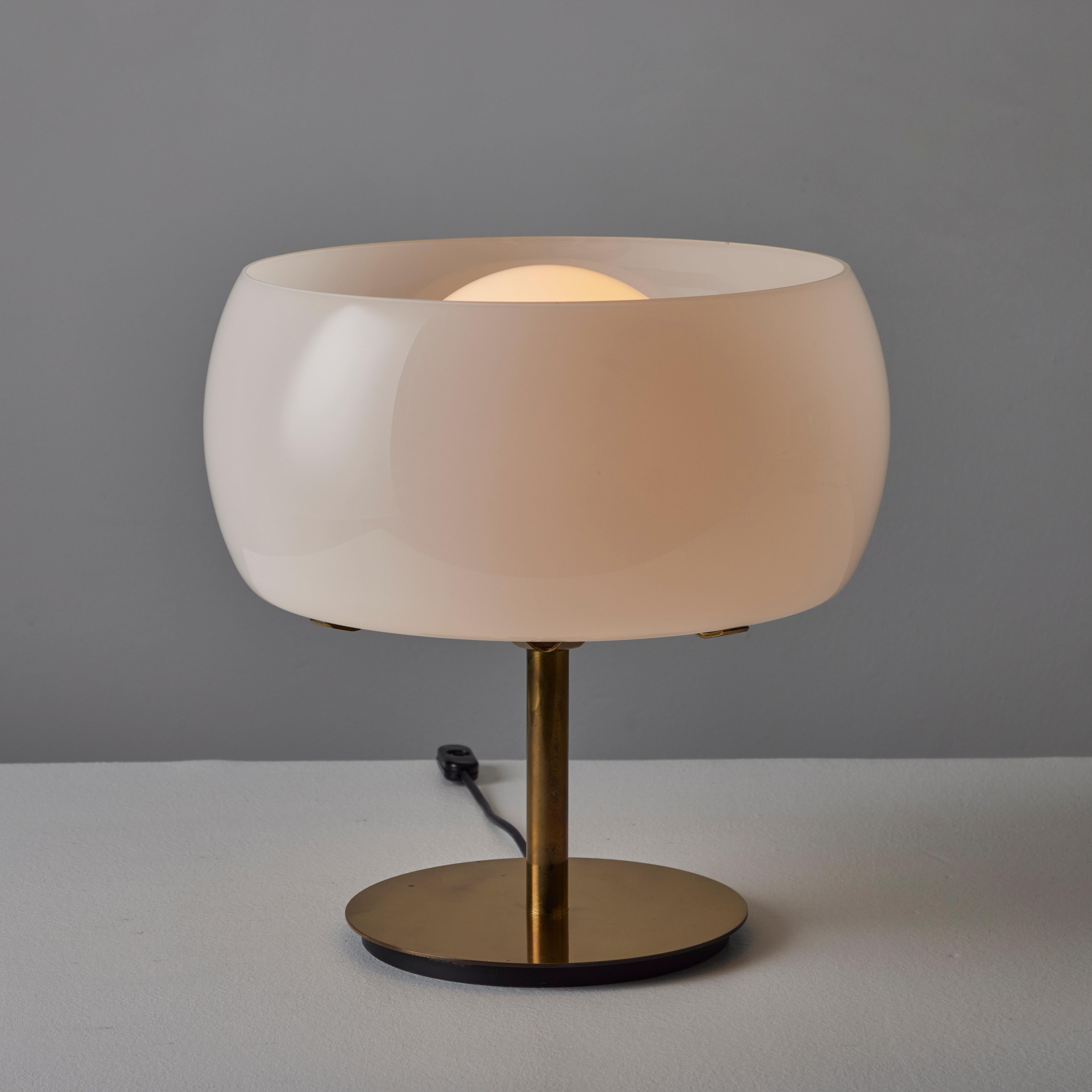 Pair of 'Erse' Table Lamps by Vico Magistretti for Artemide. Designed and manufactured in Italy, 1964. The base and stem of the lamp is constructed of polished brass. External orbital shade is made of white opaline glass which wraps around a frosted